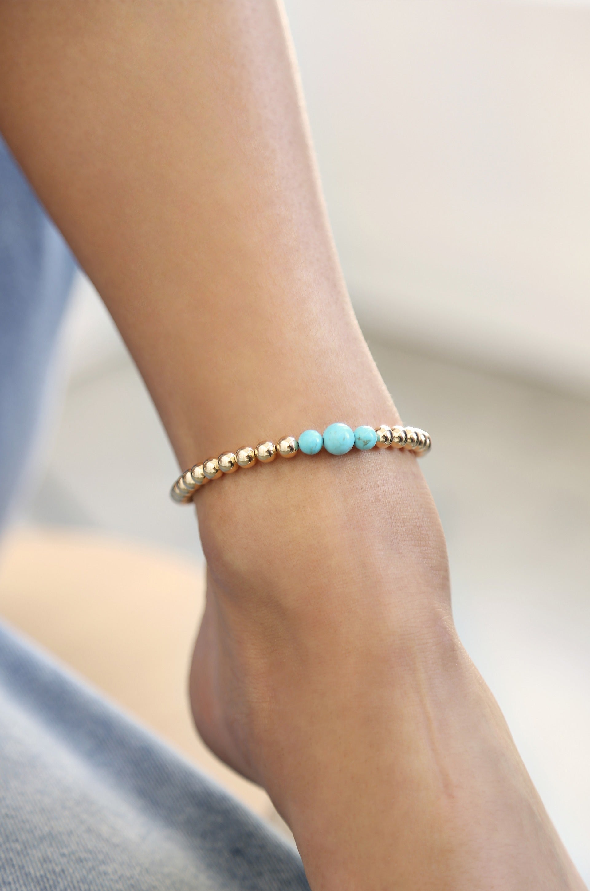 Crystal Ball Anklet in turquoise on a model