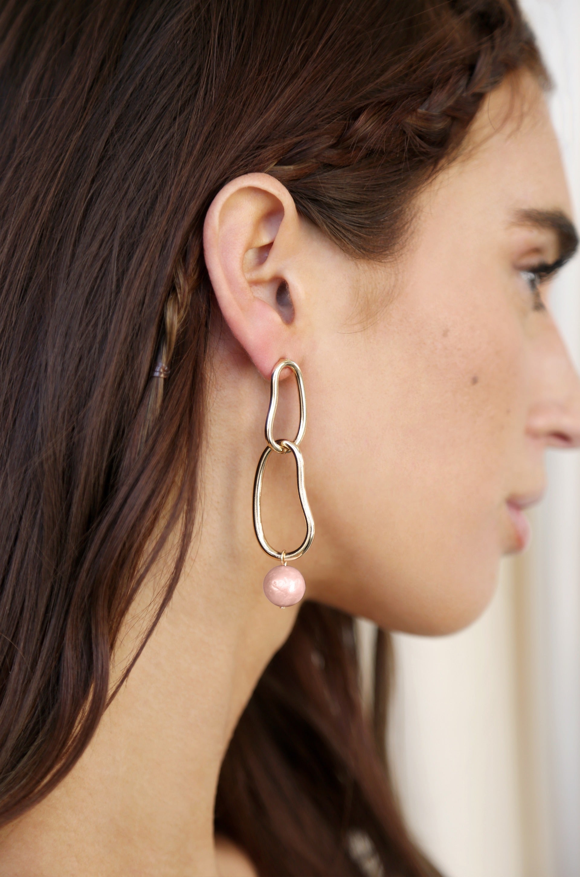 Mara Dangle Pearl 18k Gold Plated Earrings in pink on model2