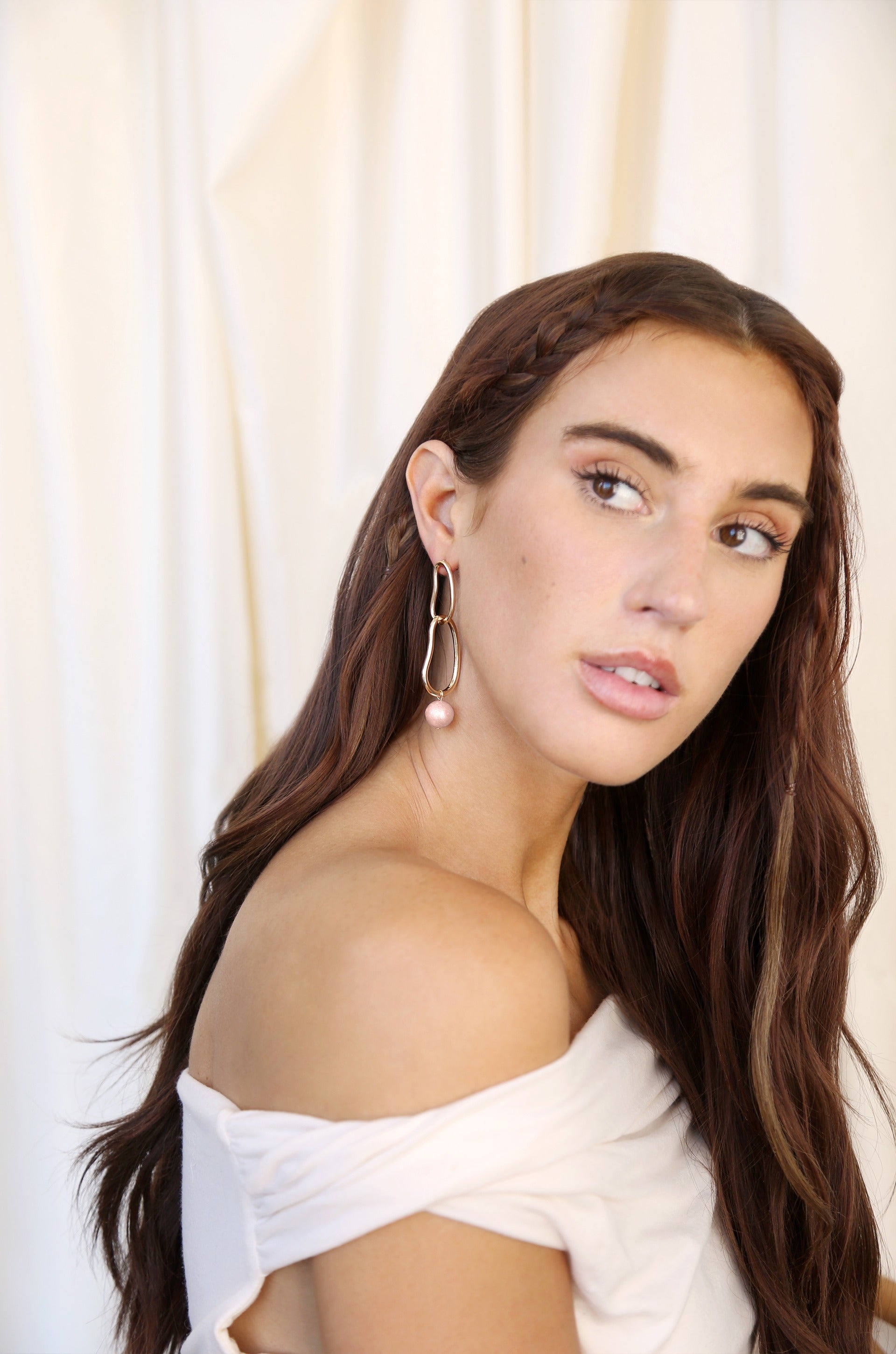 Mara Dangle Pearl Earrings in pink model 3