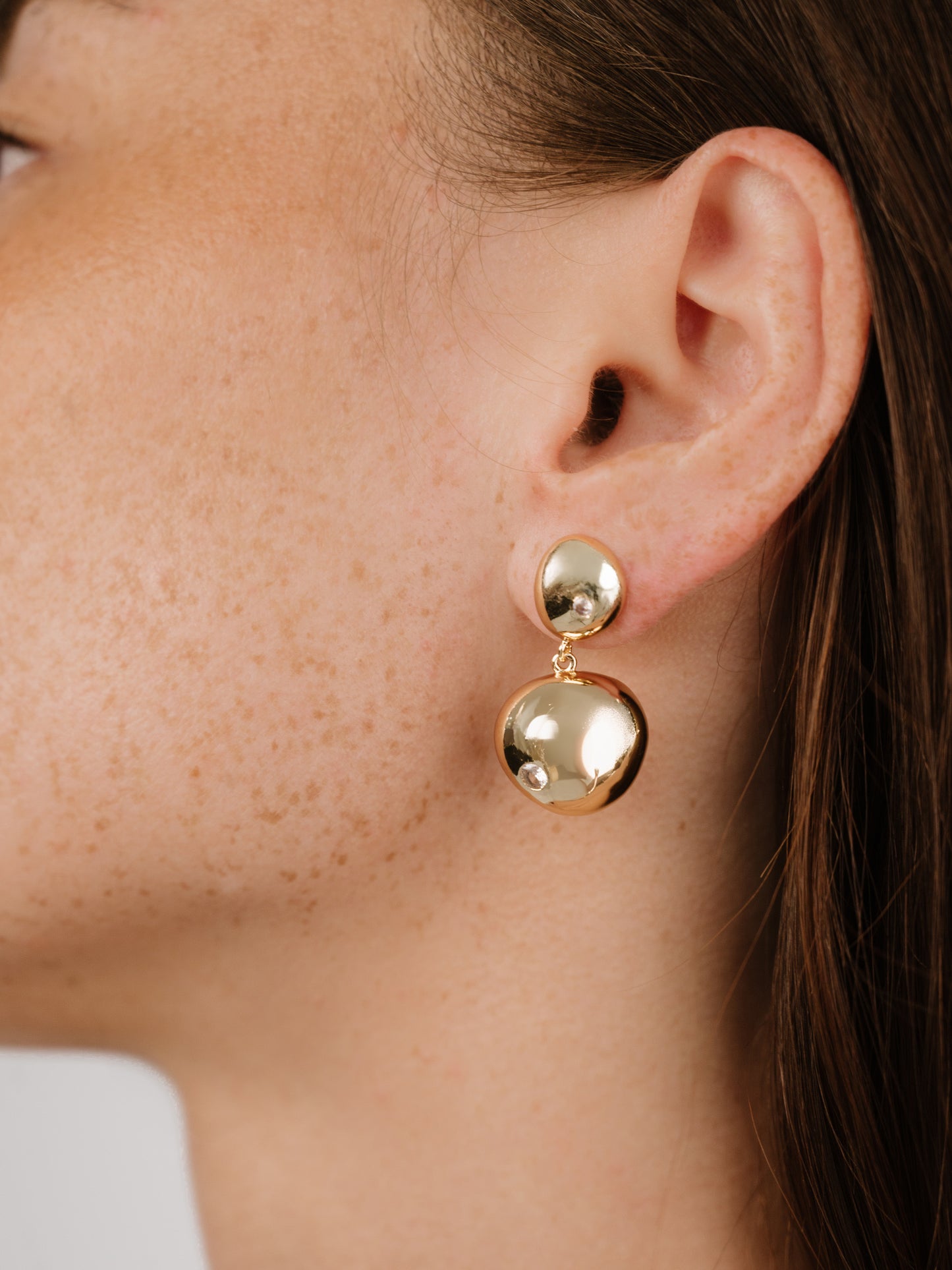Polished Double Pebble Drop Earrings on model