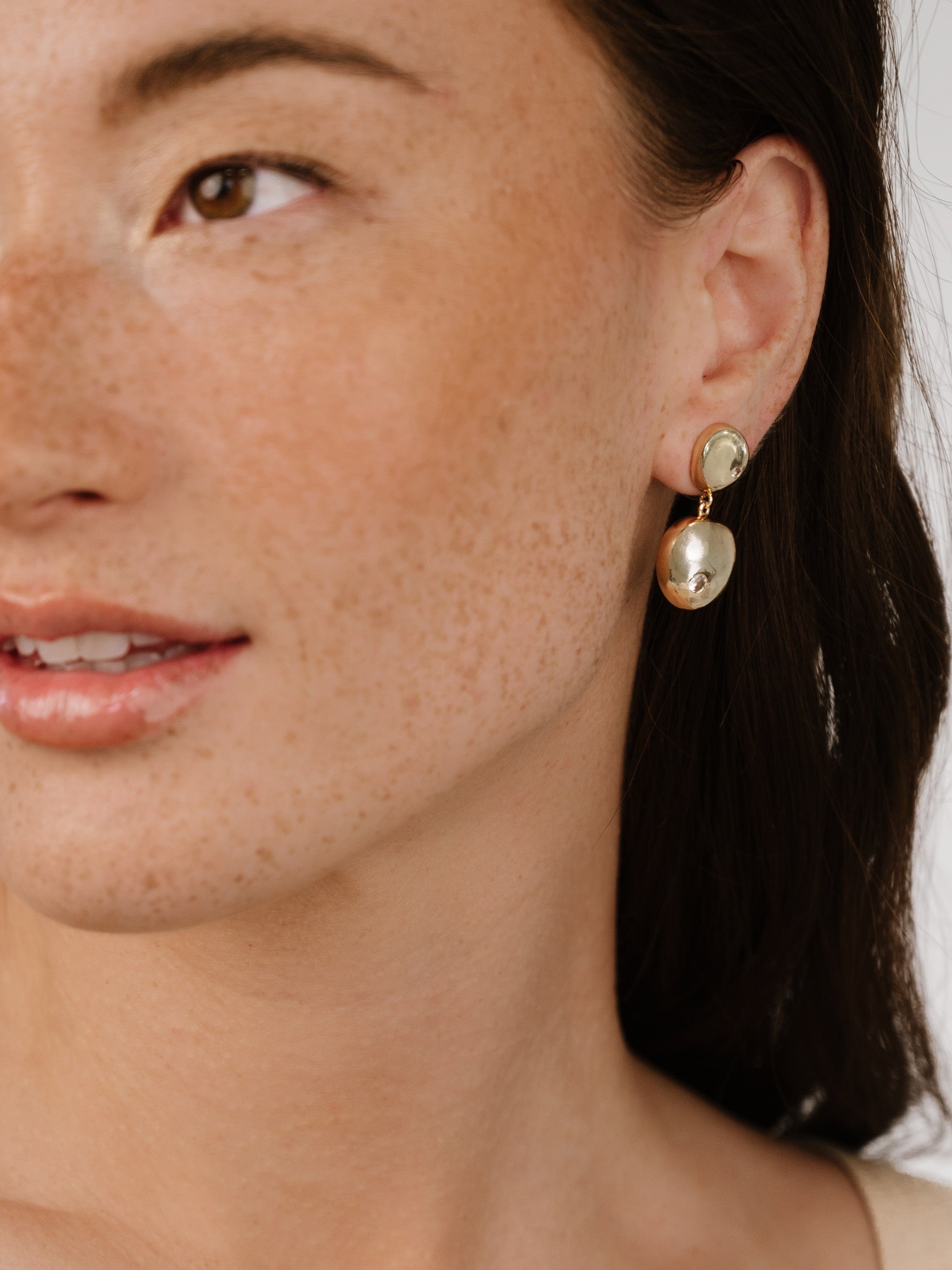 Polished Double Pebble Drop Earrings on model 5