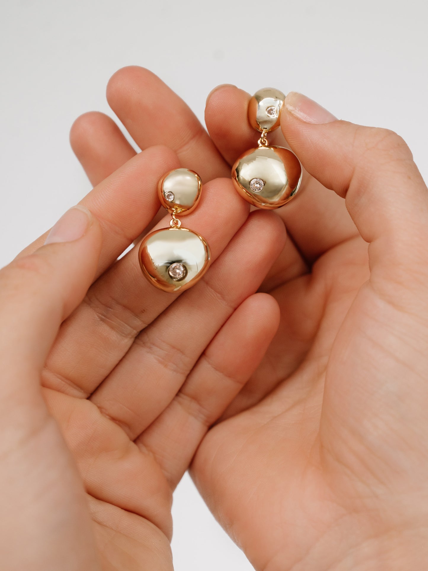 Polished Double Pebble Drop Earrings in gold view