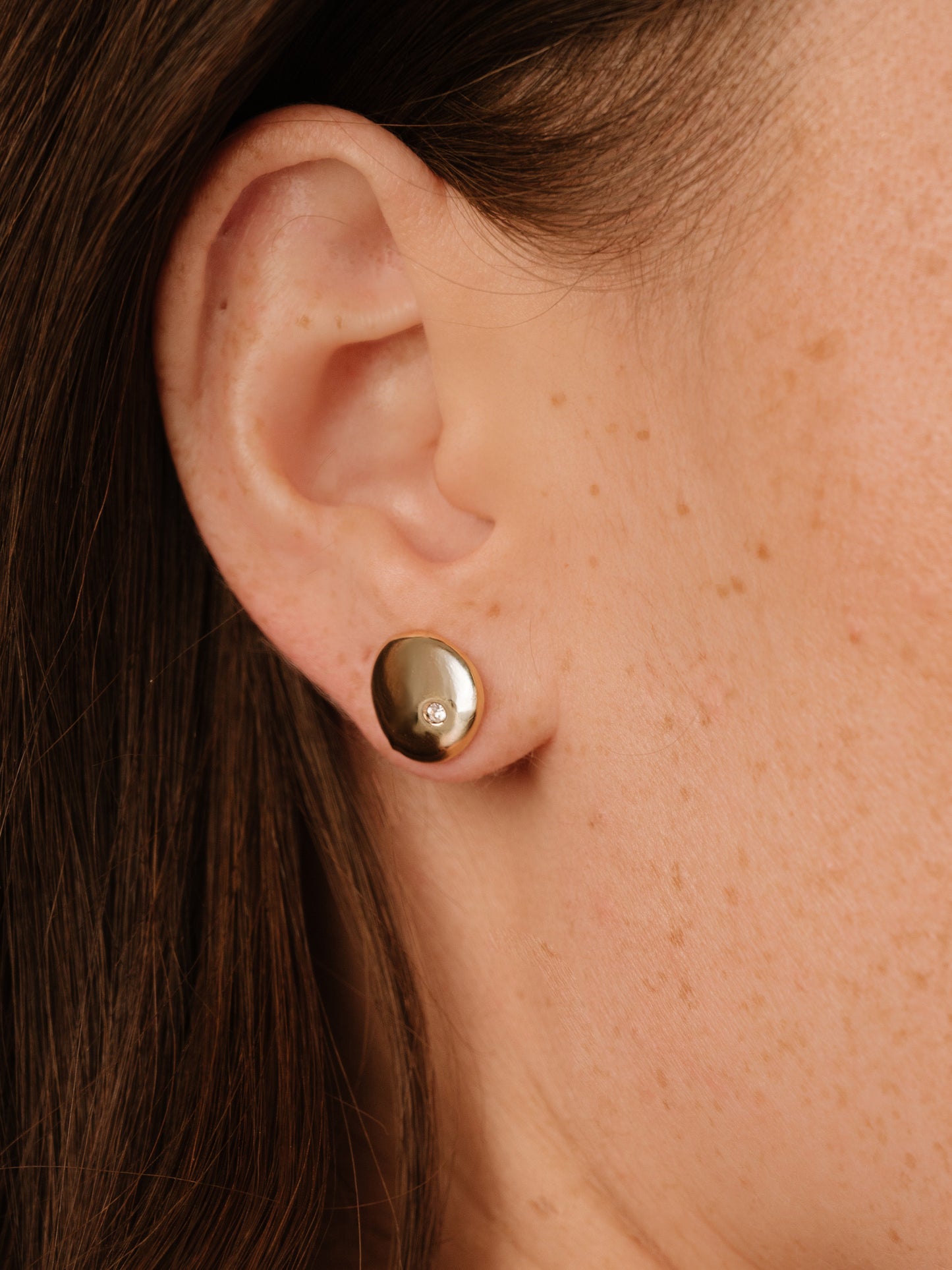 Polished Pebble Single Crystal Stud Earrings on model