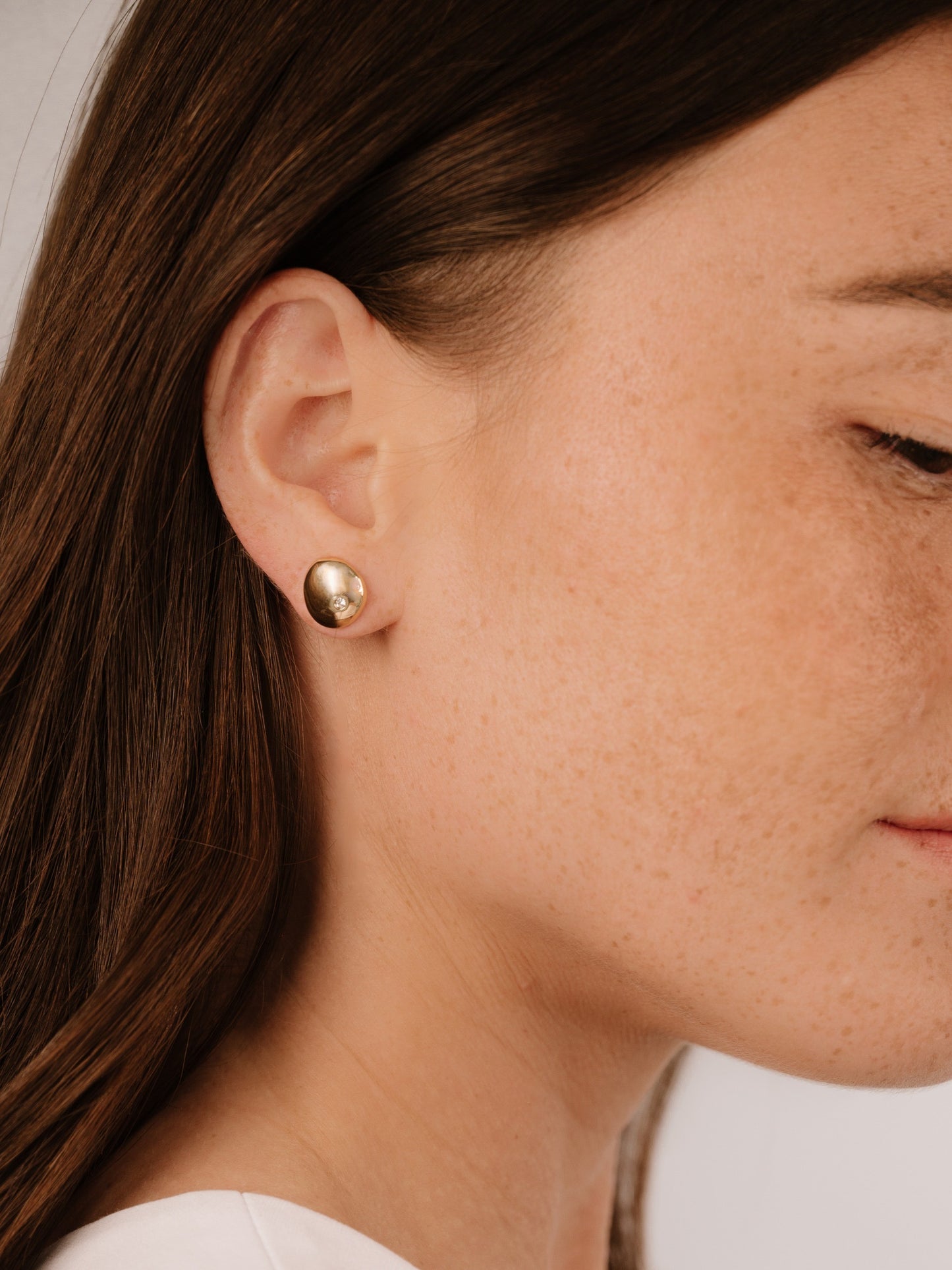 Polished Pebble Single Crystal Stud Earrings on model 3