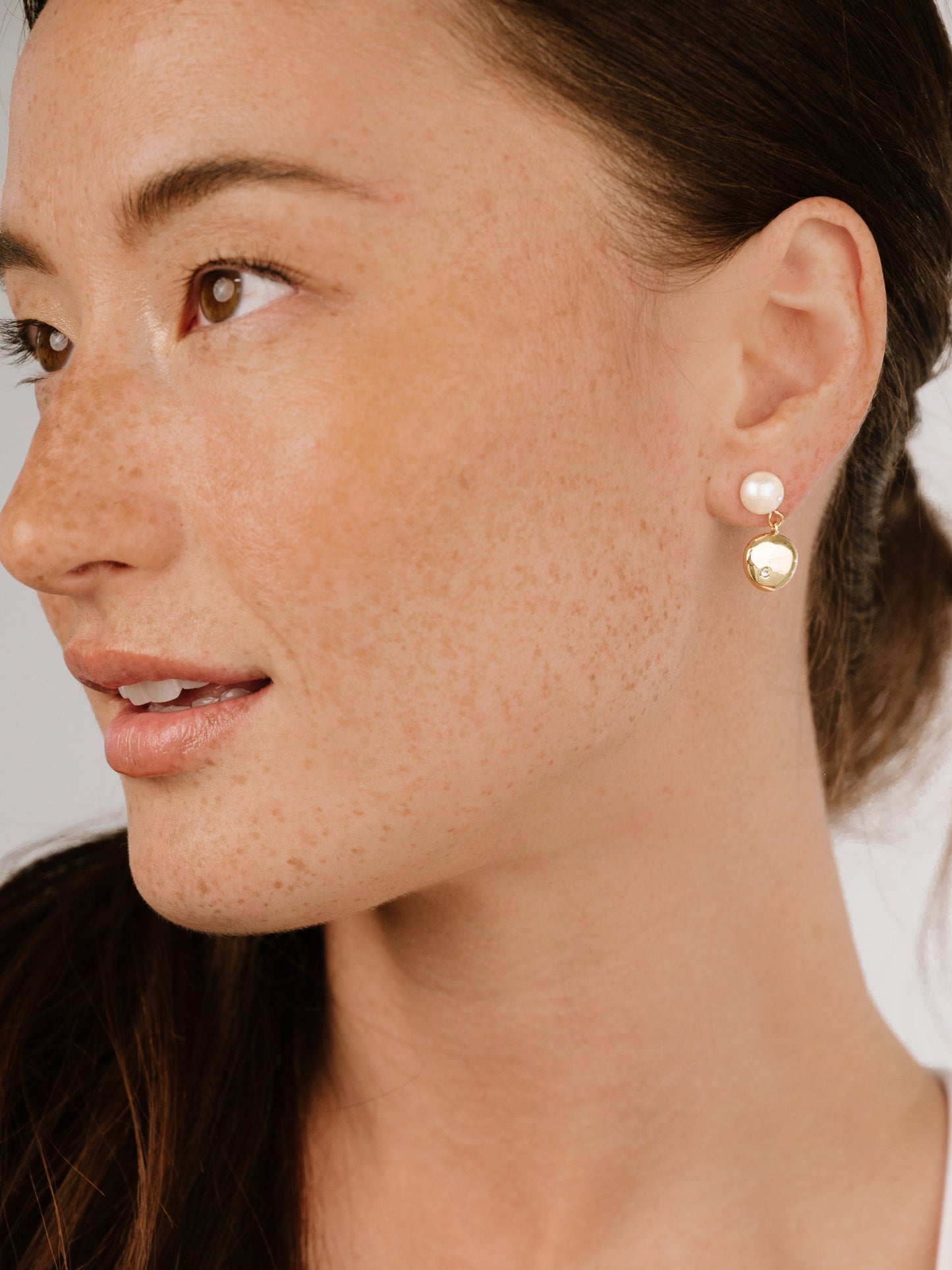 Small Pebble and Pearl Dangle Earrings on model 3