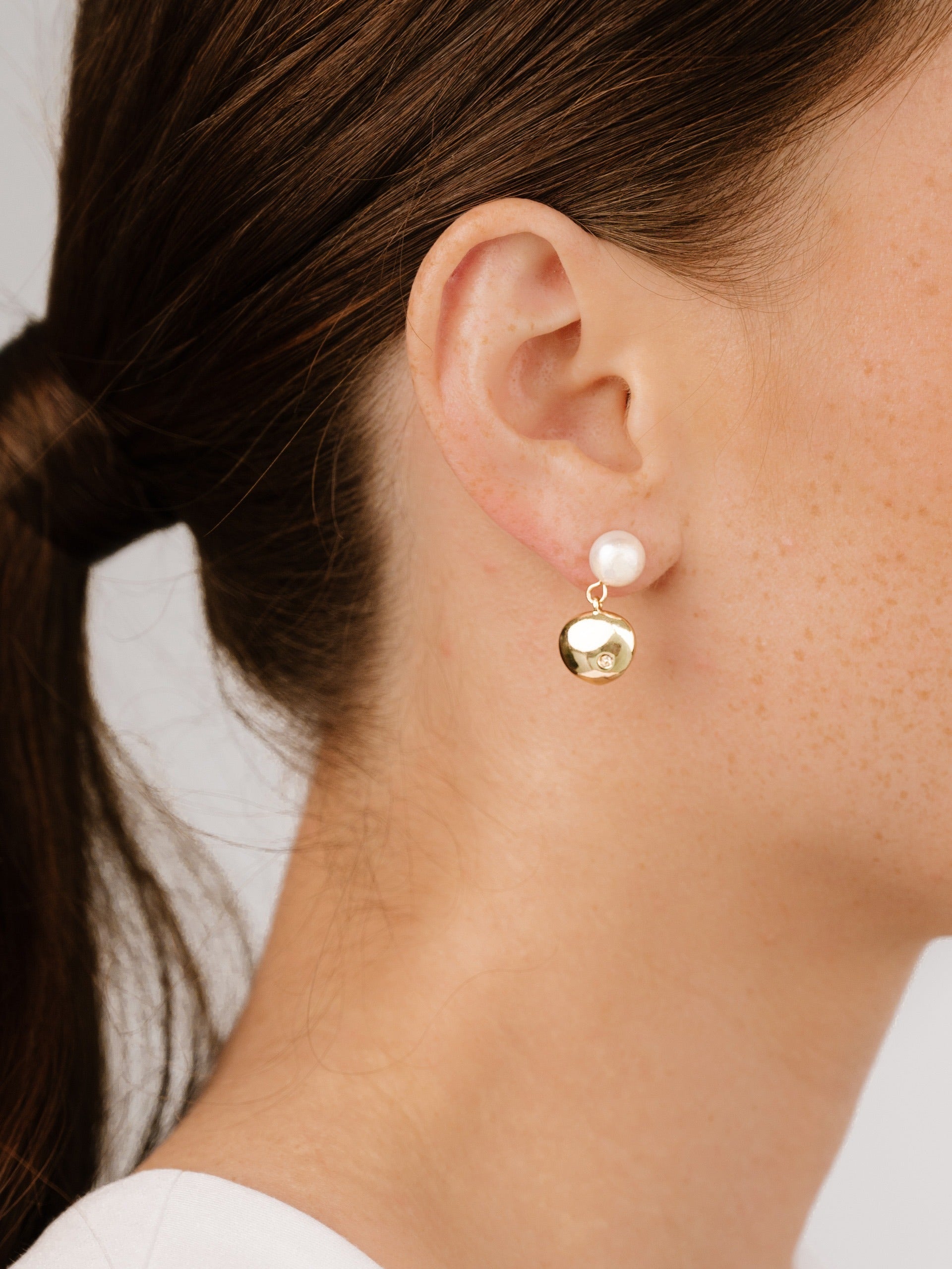 Small Pebble and Pearl Dangle Earrings on model 2