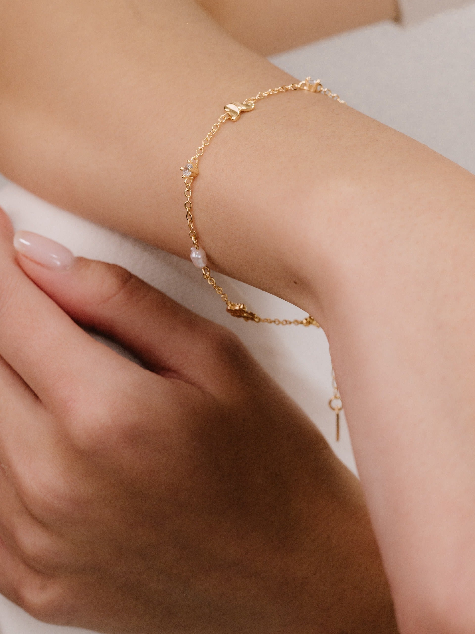 Subtle Butterflies and Pearl Bracelet on model 2