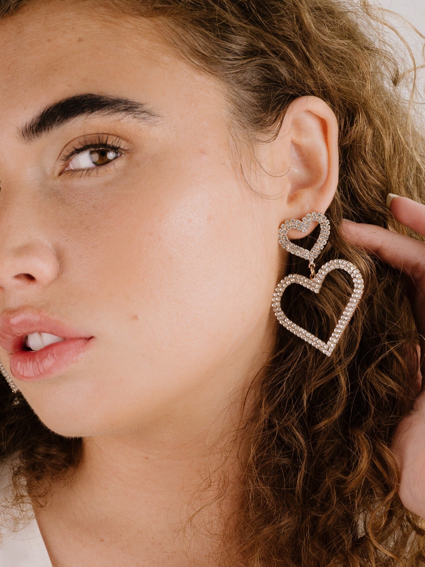 Double Trouble Heart Crystal Earrings on model