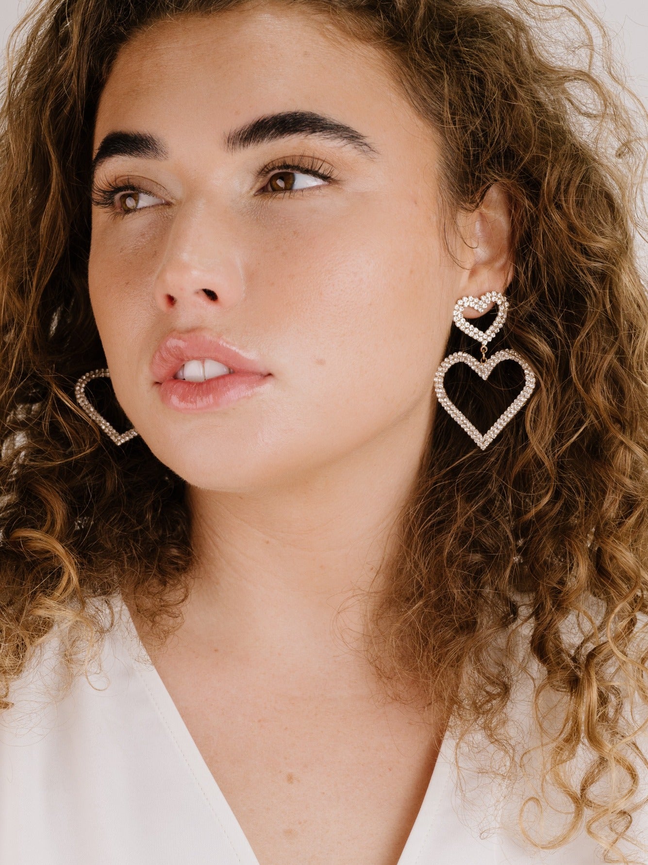Double Trouble Heart Crystal Earrings on model 3