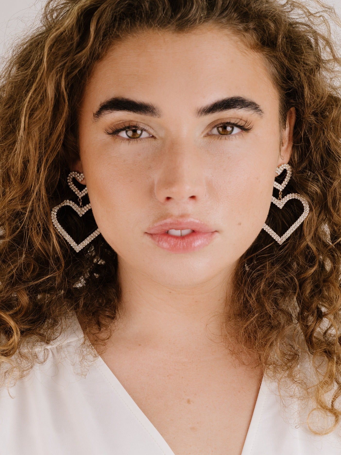 Double Trouble Heart Crystal Earrings on model 2