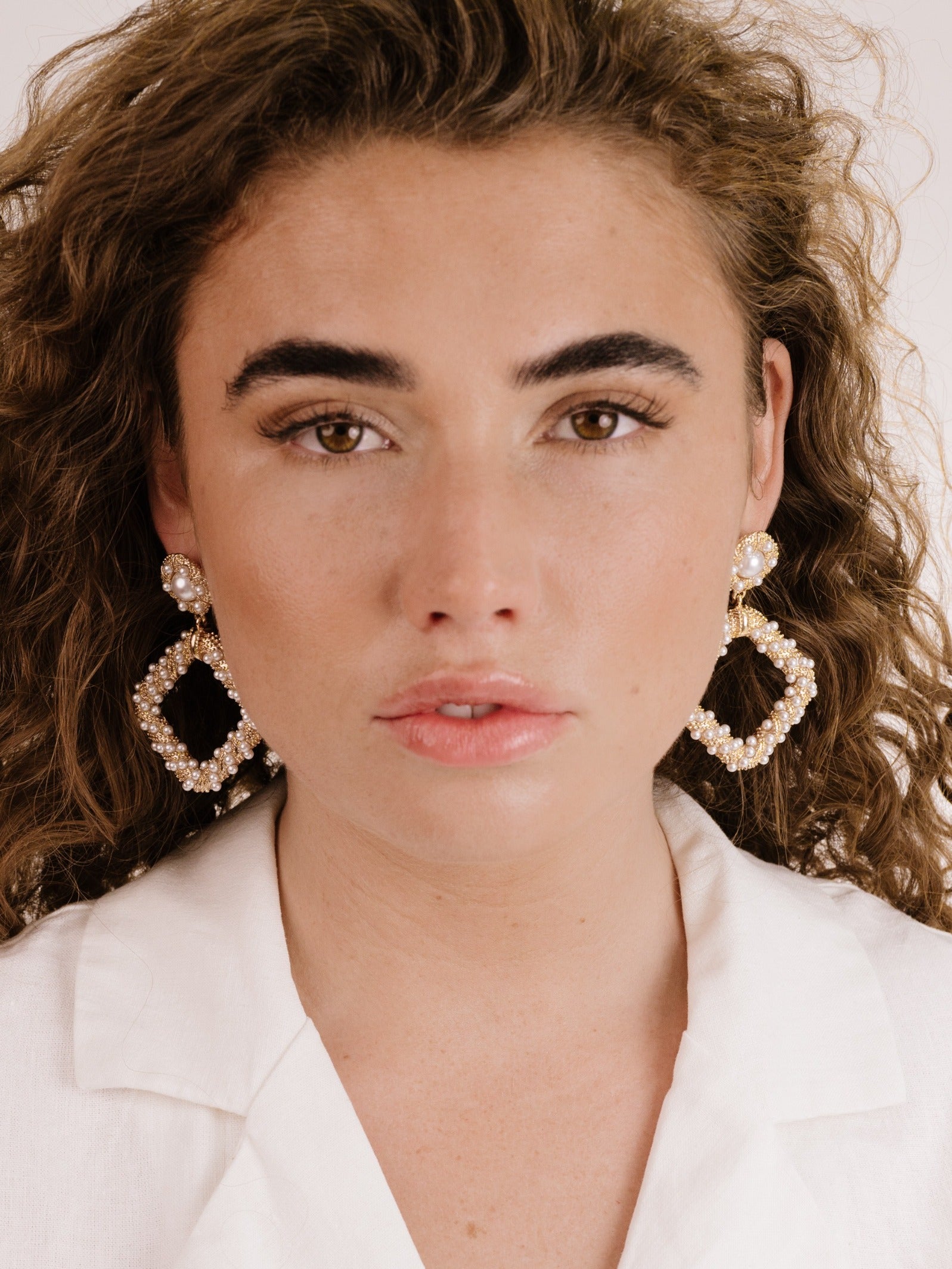 Pearl Knocker Earrings on model 3