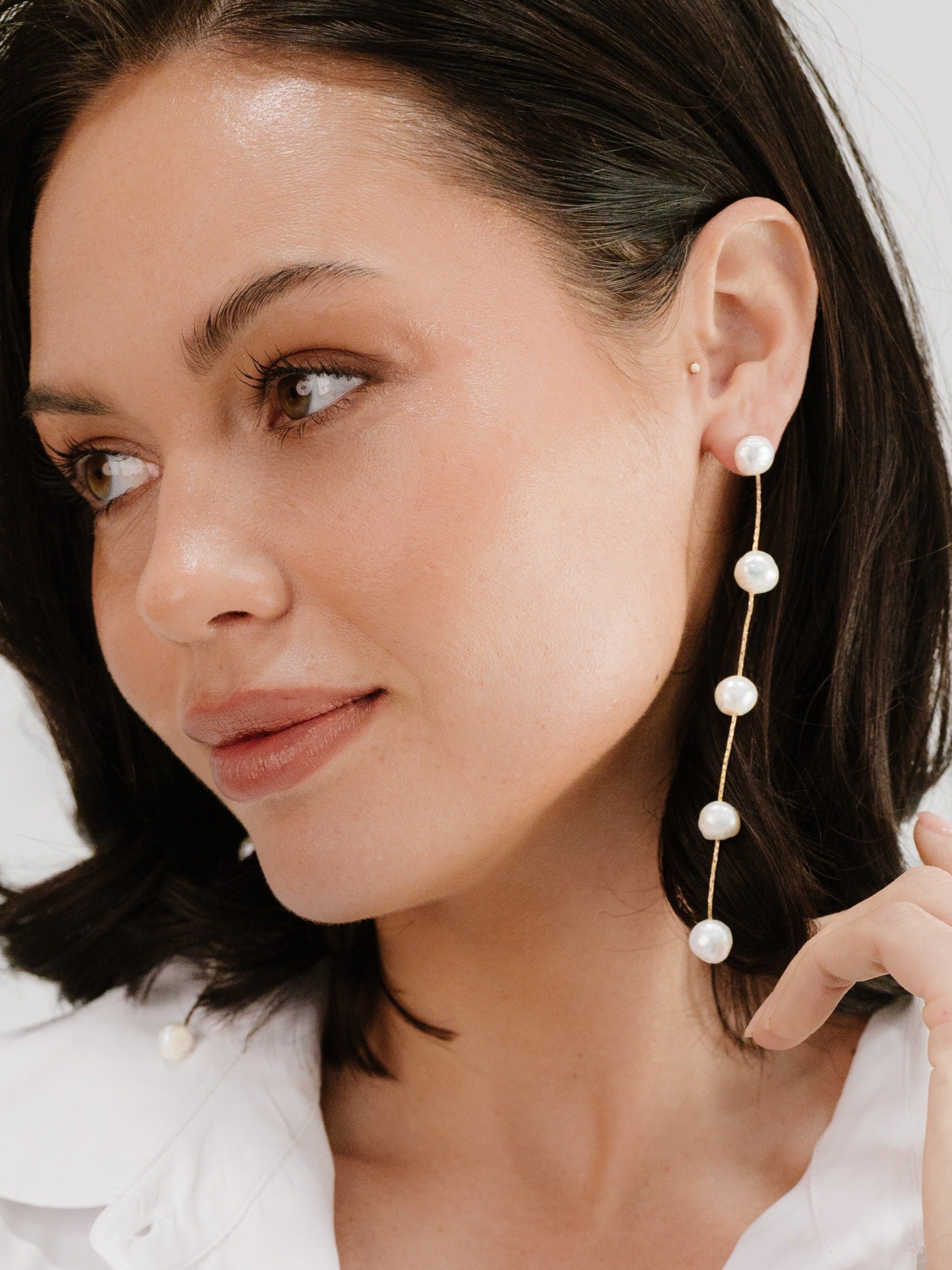 Dripping Pearl Delicate Drop Earrings on model