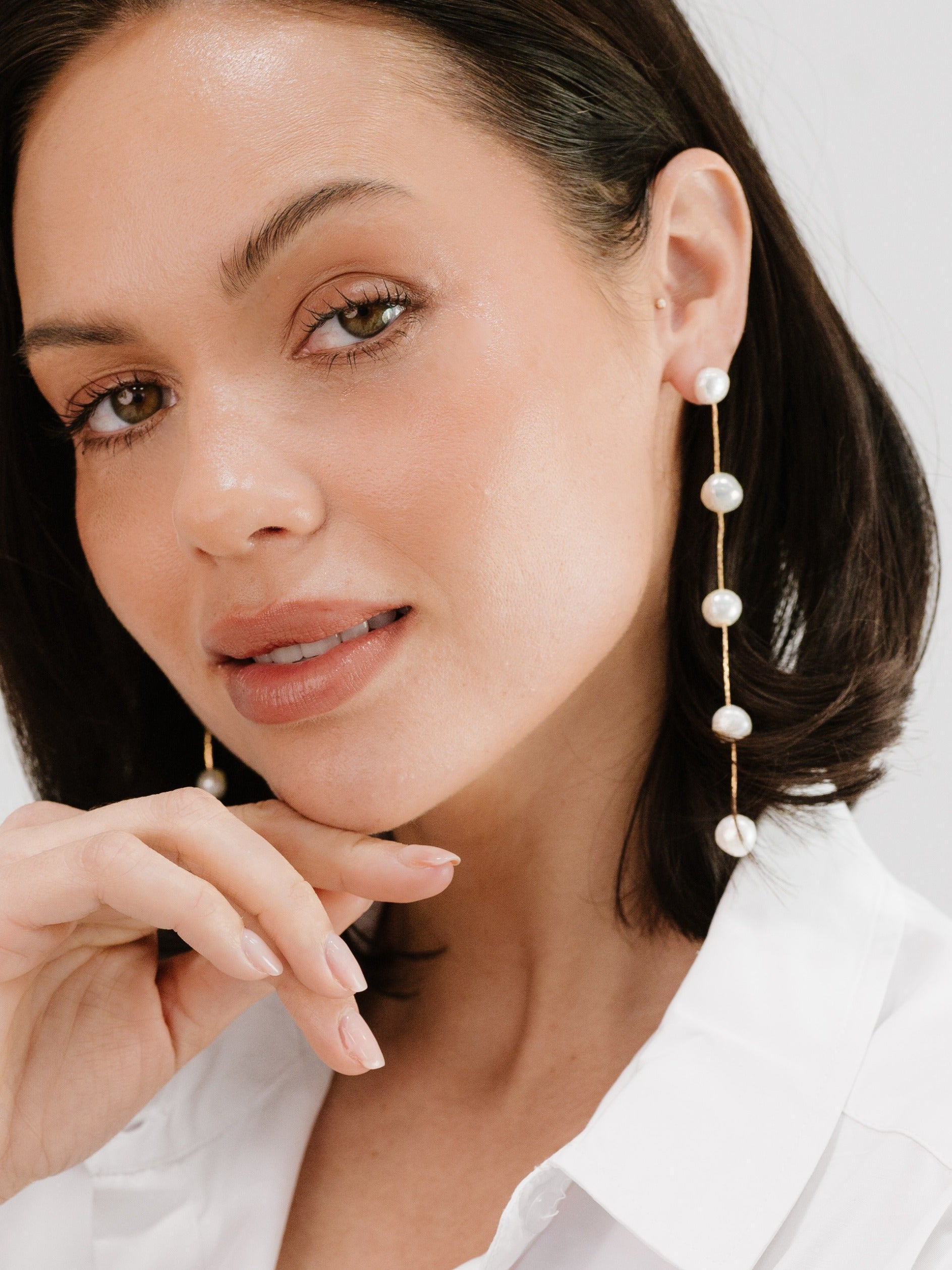 Dripping Pearl Delicate Drop Earrings on model 2