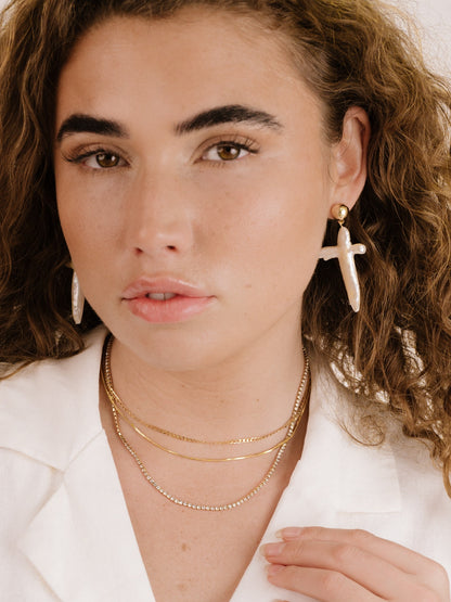 Organic Freshwater Pearl Cross Earrings on model 4