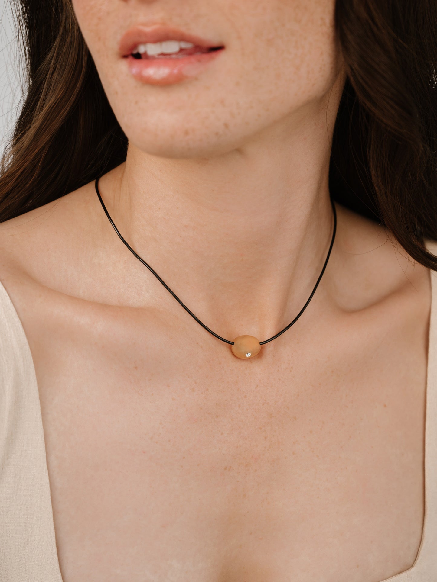 Single Crystal Polished Pebble Leather Pendant Necklace on model 3