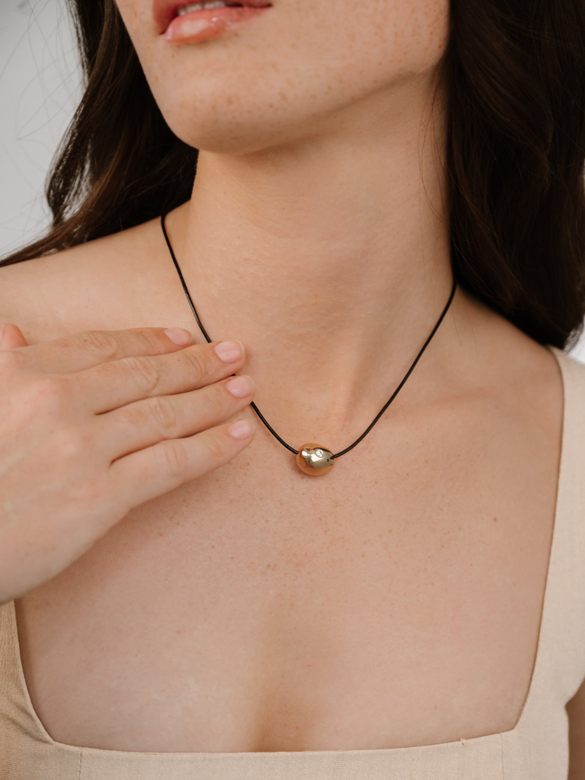 Single Crystal Polished Pebble Leather Pendant Necklace on model 4