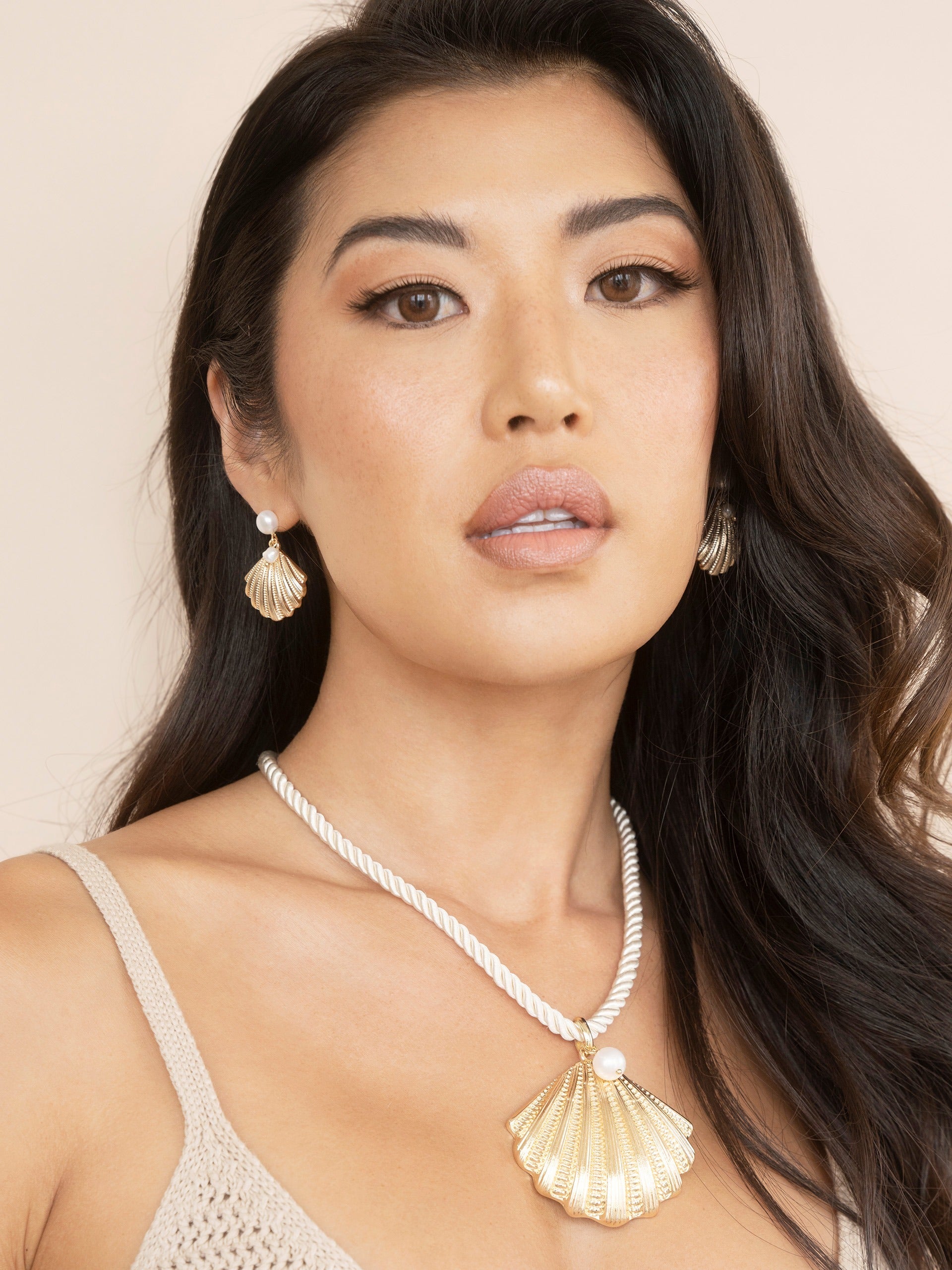 Scallop Shell and Pearl Earrings on model 2