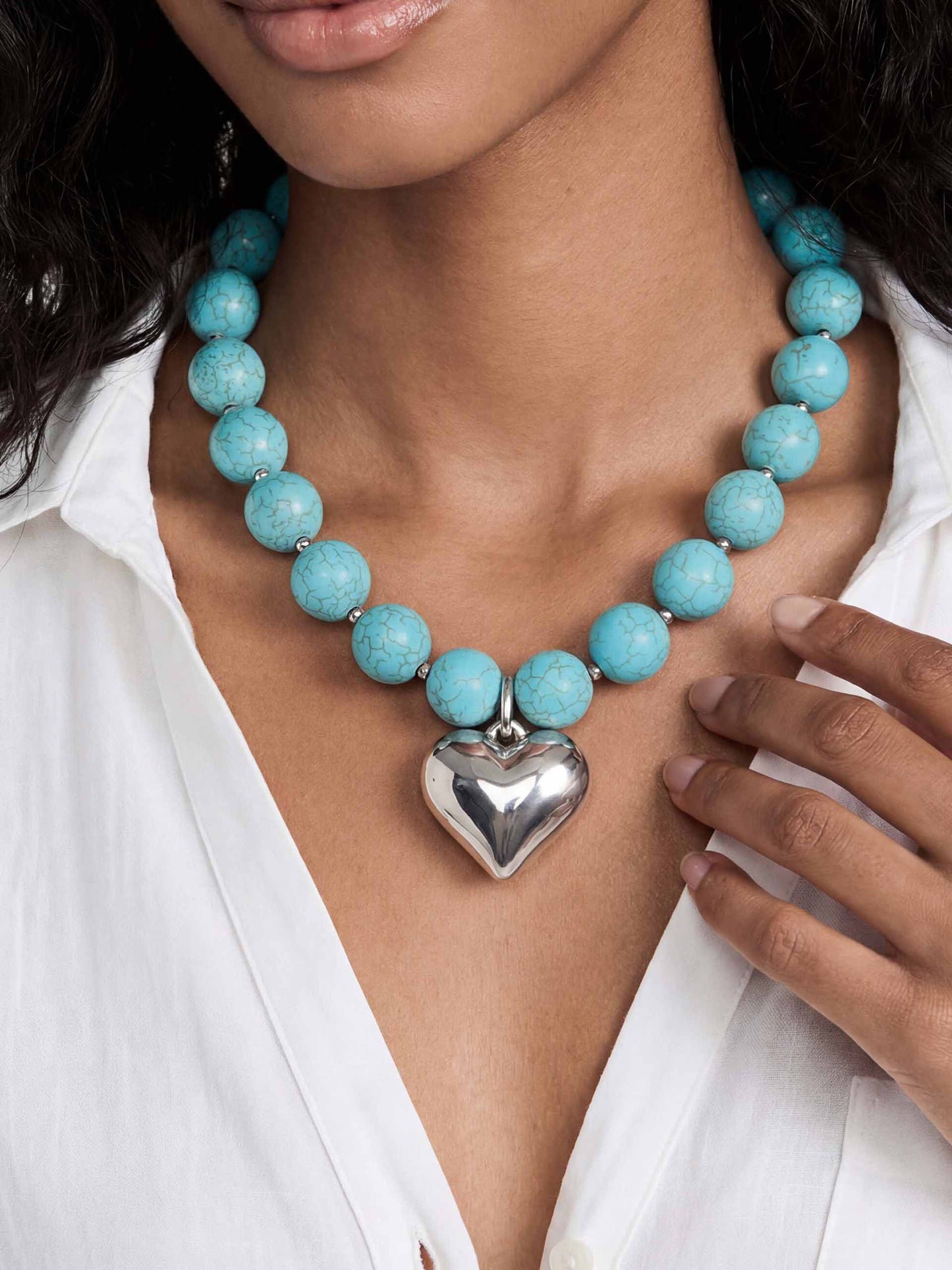 Luck and Love Turquoise Heart Necklace Turquoise with Silver Plating on model 1