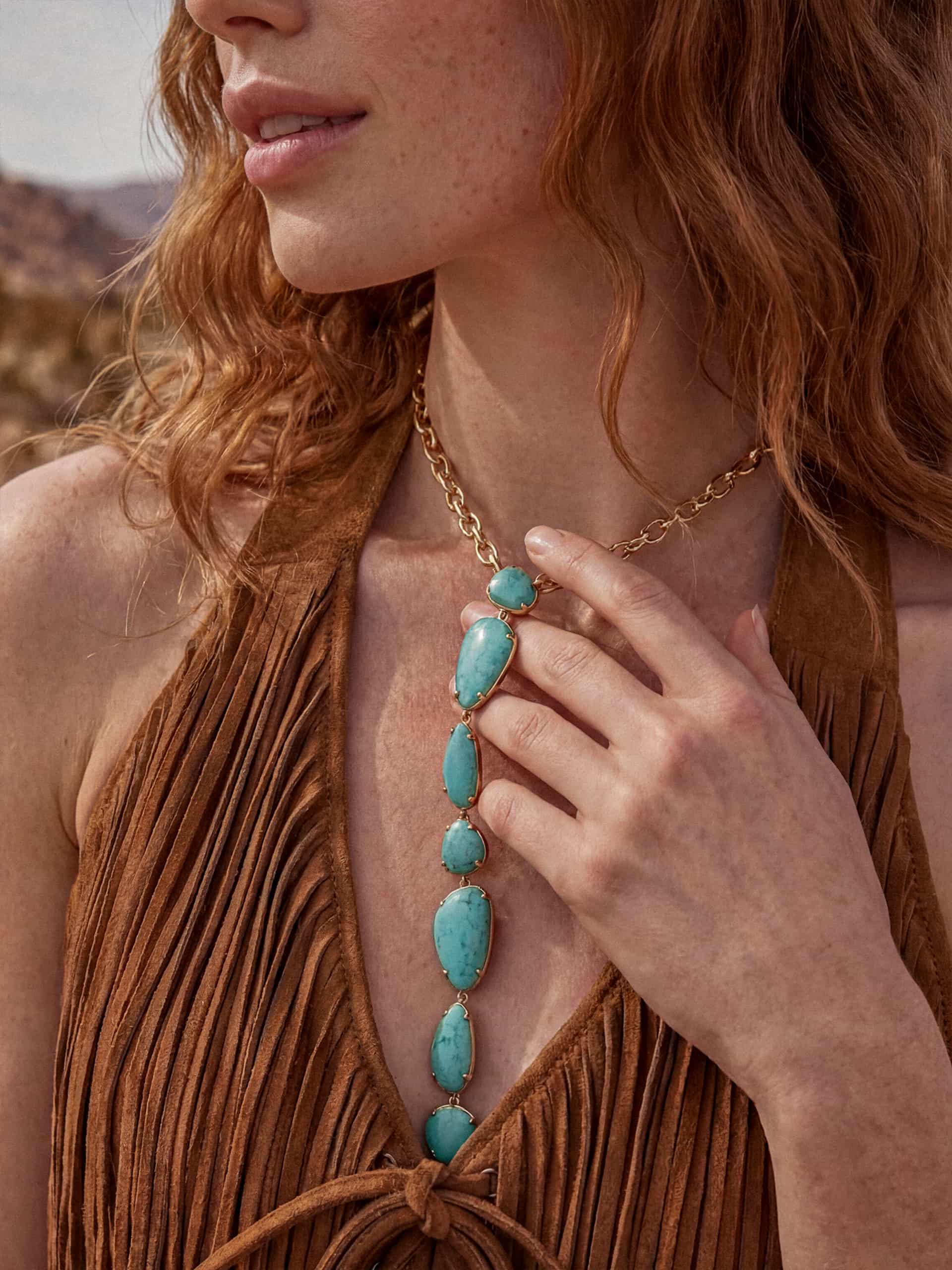 Model wearing turquoise beaded necklace