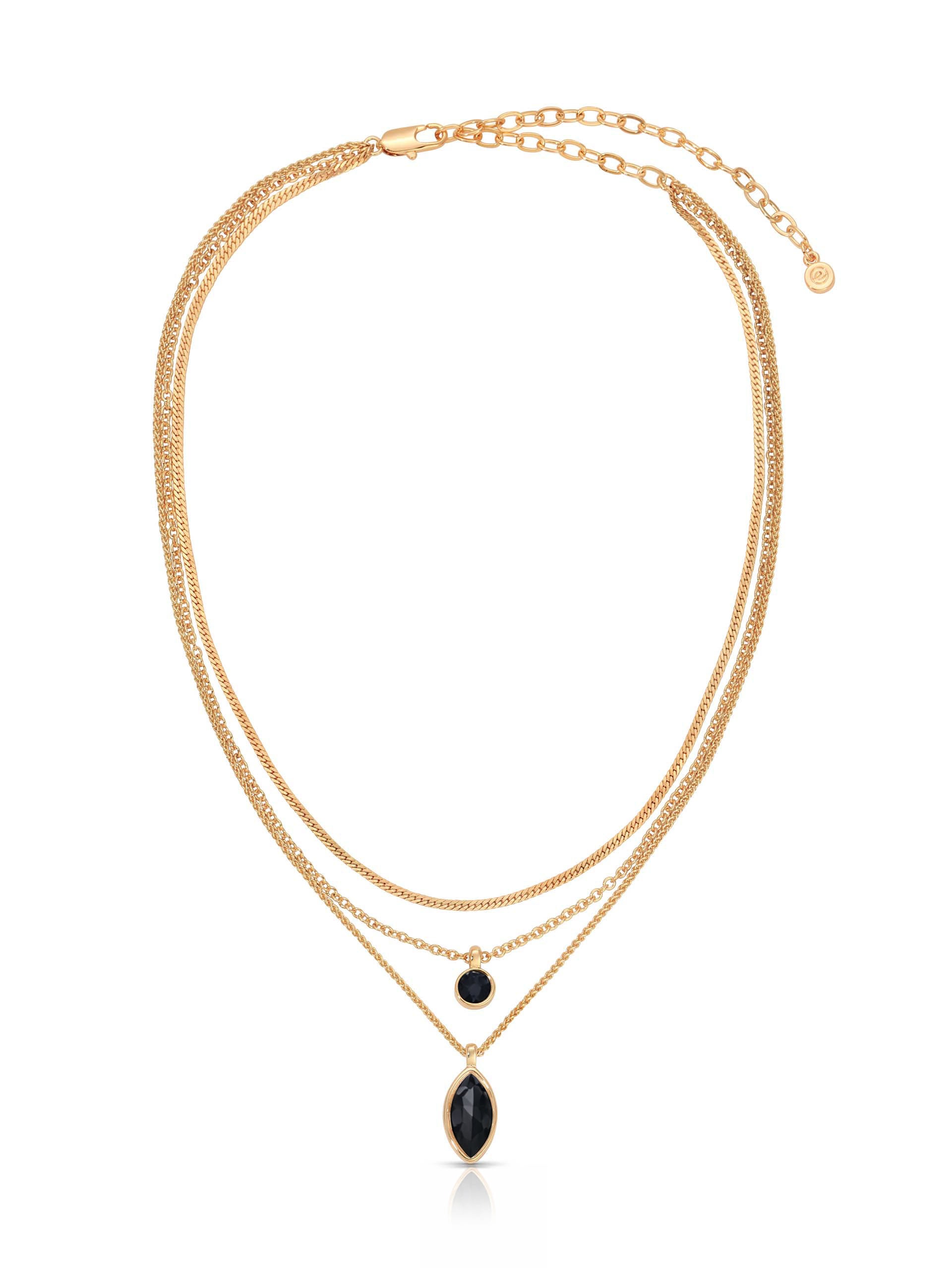 Elegant gold layered necklace with two fine chains, a black bead accent, and an elongated black teardrop pendant on a white background.