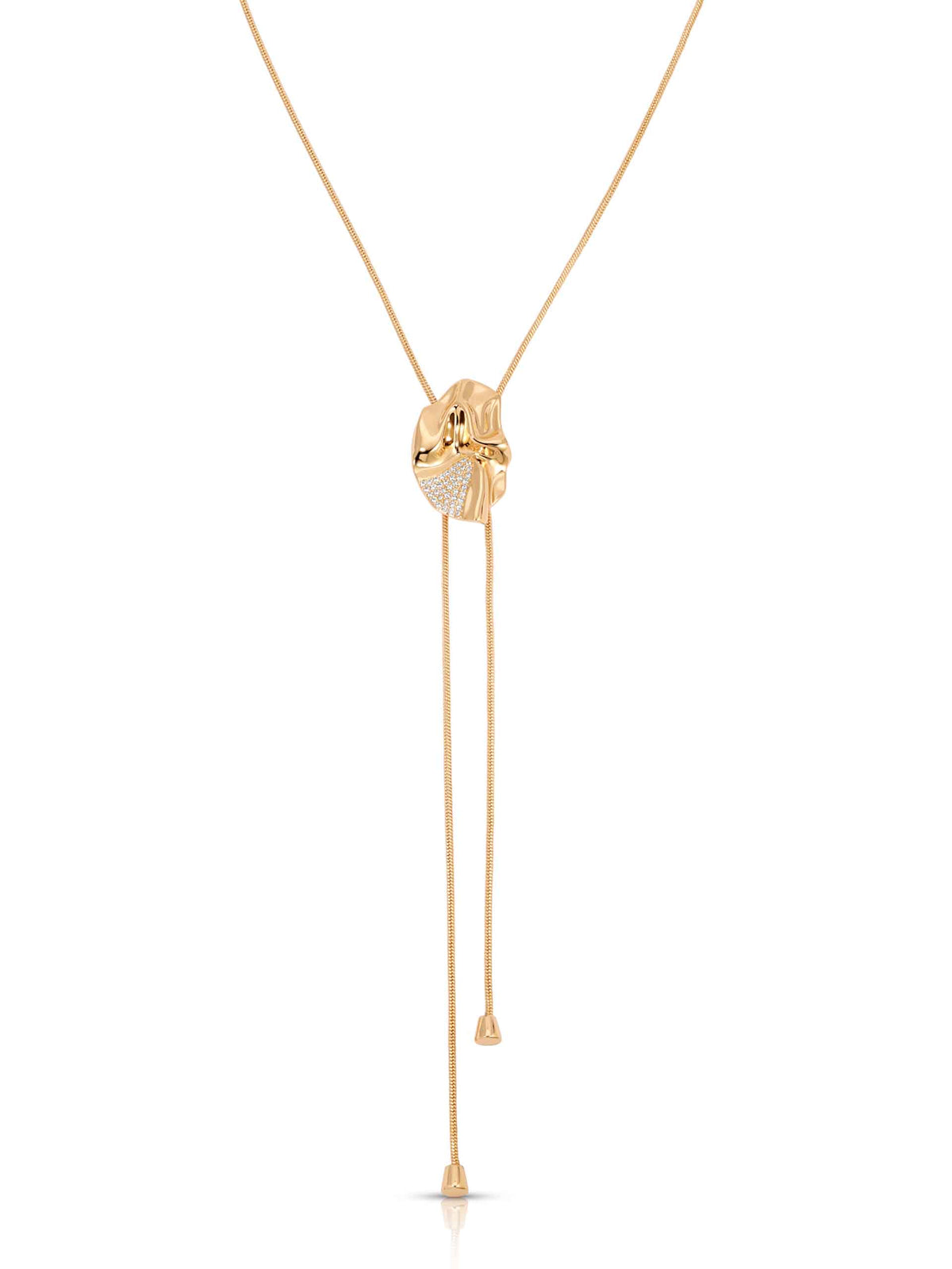 A gold-toned Y-necklace featuring a central heart-shaped pendant encrusted with small clear stones, with two long dangling chains hanging below on a plain white background.