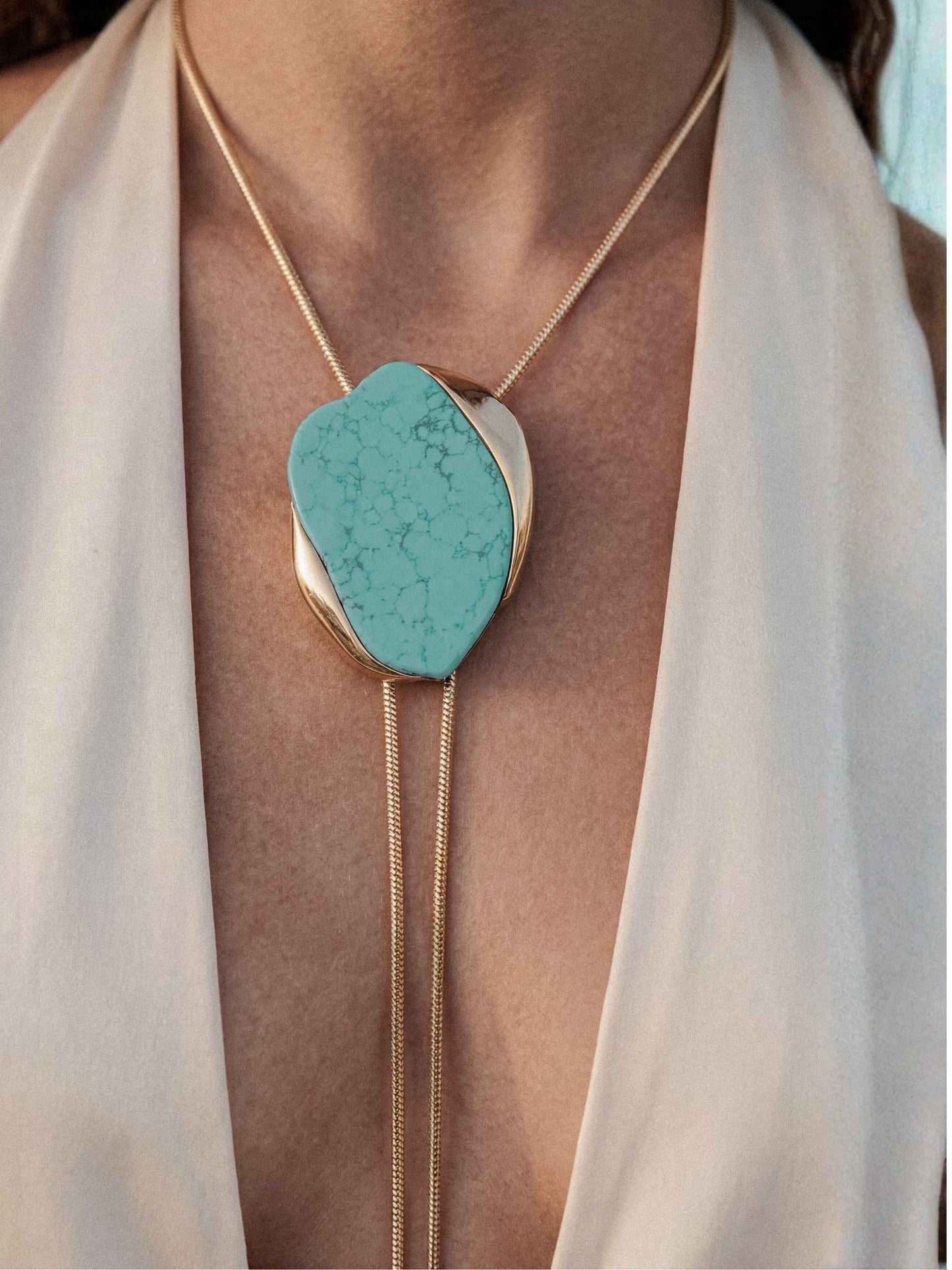 turquoise bolo necklace on model close p