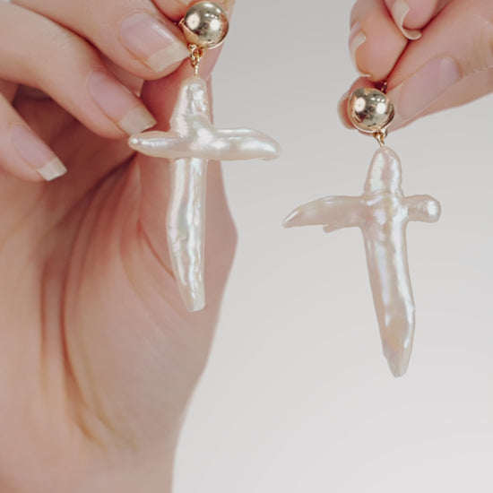 Organic Freshwater Pearl Cross Earrings on model in video