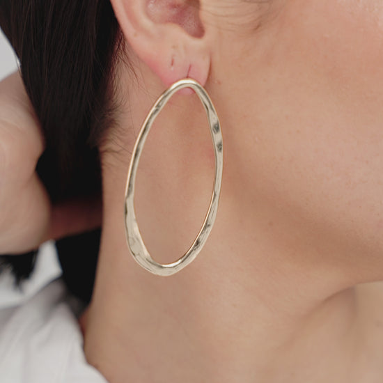 Hammered Large Oval Earrings on model in video