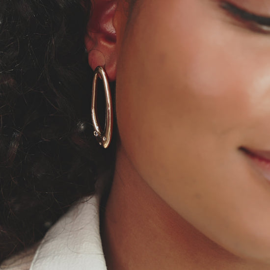 Molten Crystal Dotted Oval Earrings on model in video