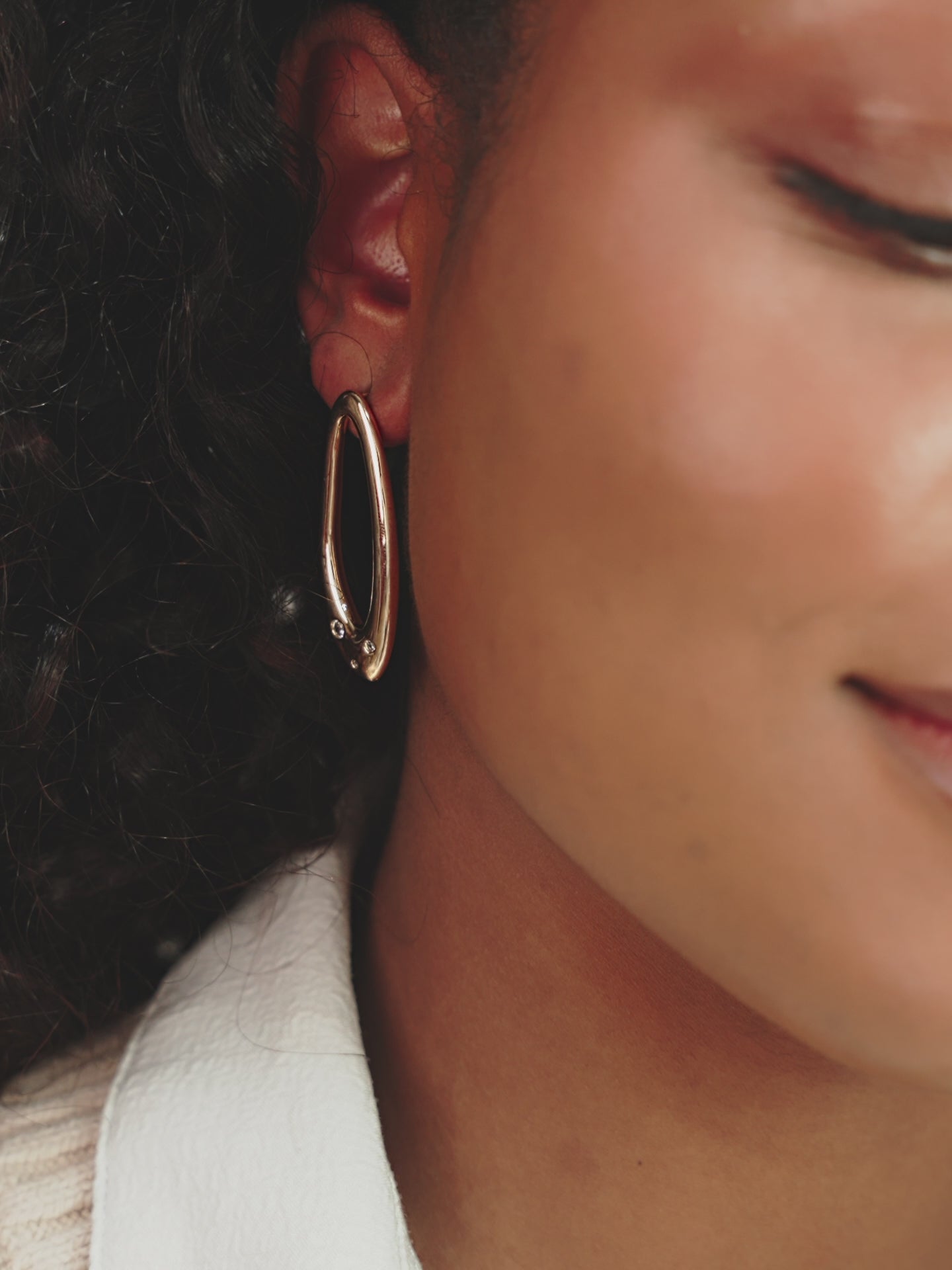 Molten Crystal Dotted Oval Earrings on model in video