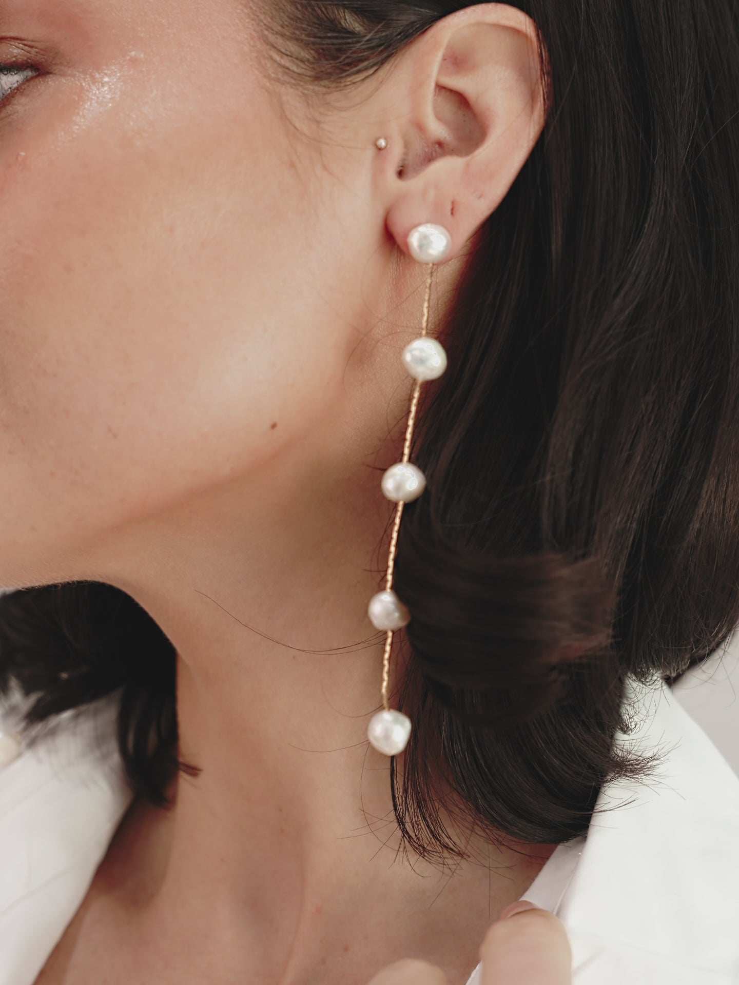 Dripping Pearl Delicate Drop Earrings on model  in video