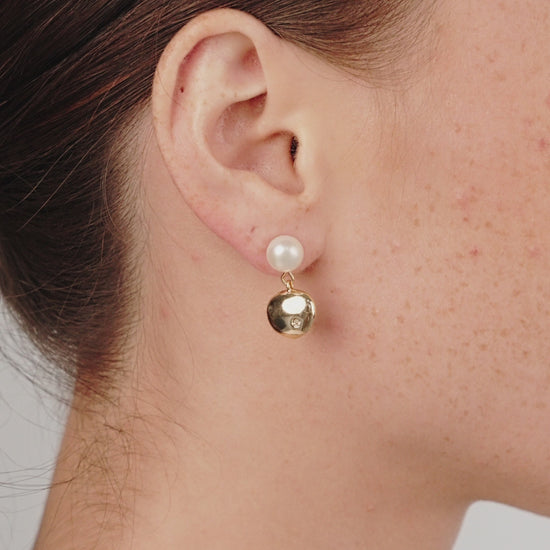 Small Pebble and Pearl Dangle Earrings on model in video