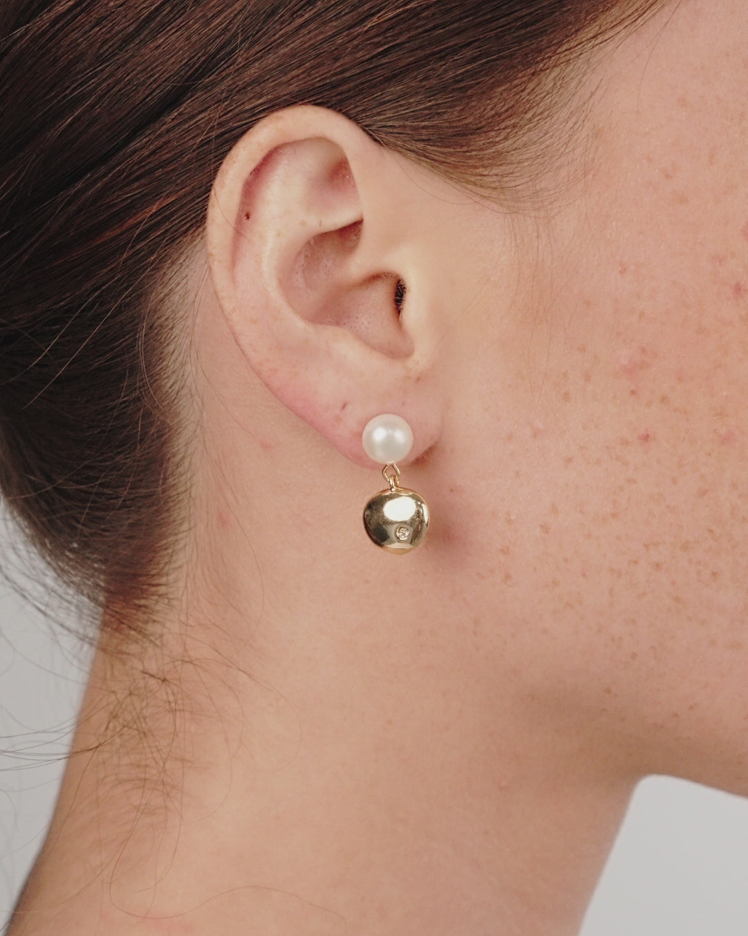 Small Pebble and Pearl Dangle Earrings on model in video
