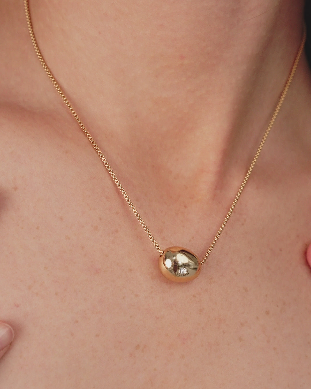 Crystal Dot Pebble Pendant Necklace on model in video