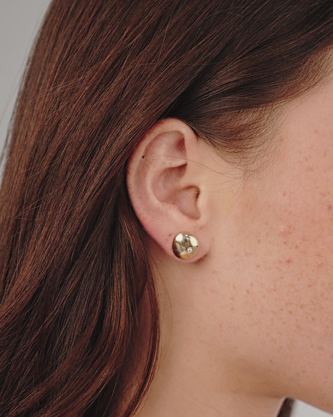 Polished Pebble Single Crystal Stud Earrings in gold model in video
