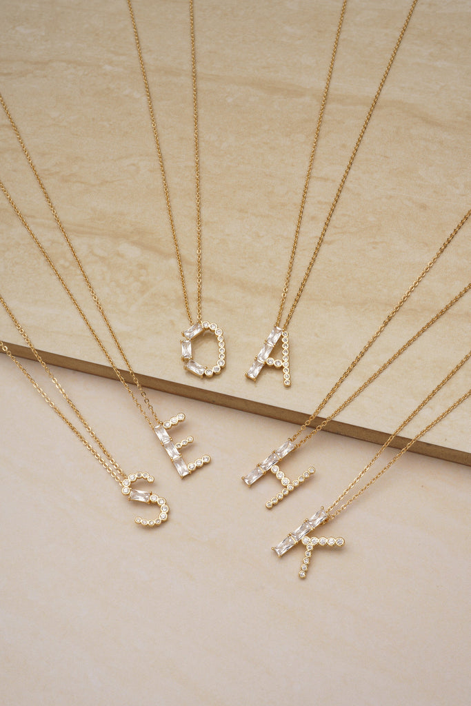 Mixed Crystal Initial 18k Gold Plated Necklace on slate