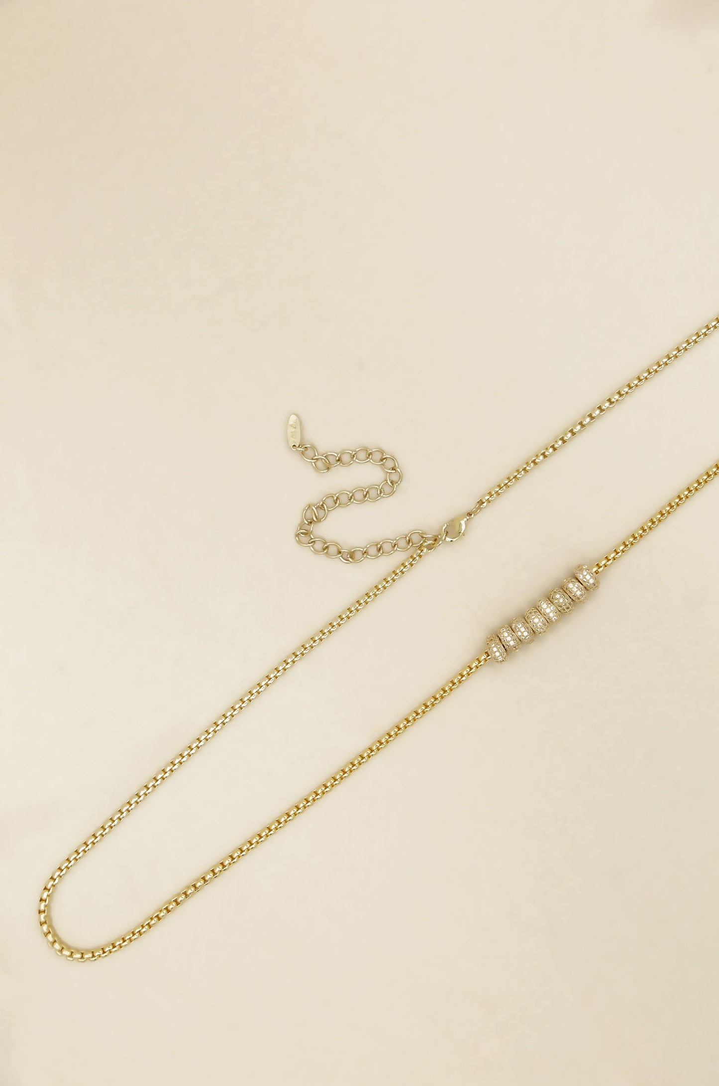Single Strand Gold Plated Body Chain on satin