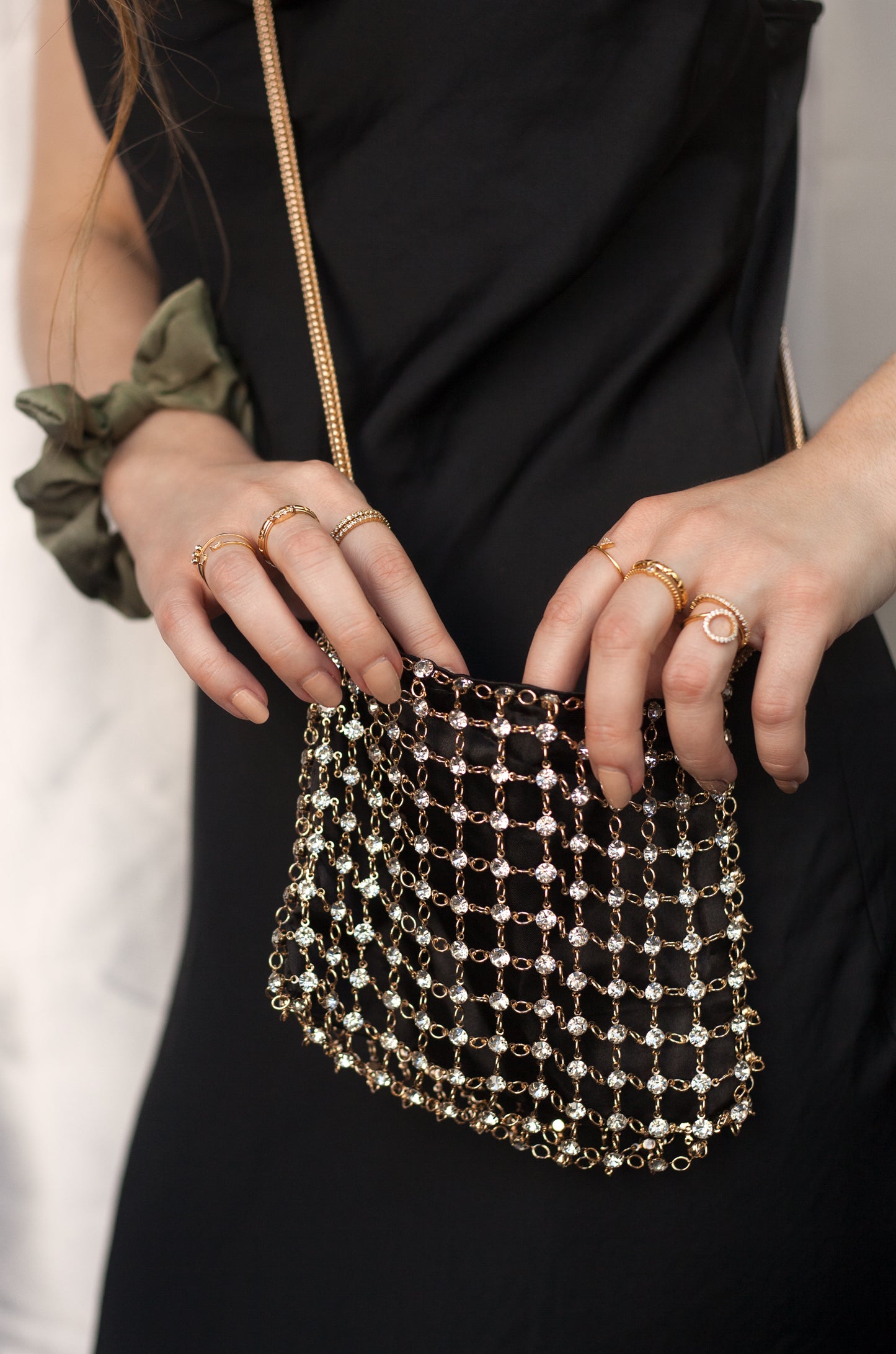 Crystal Criss Cross Chain Bag in Black & Gold shown on a model