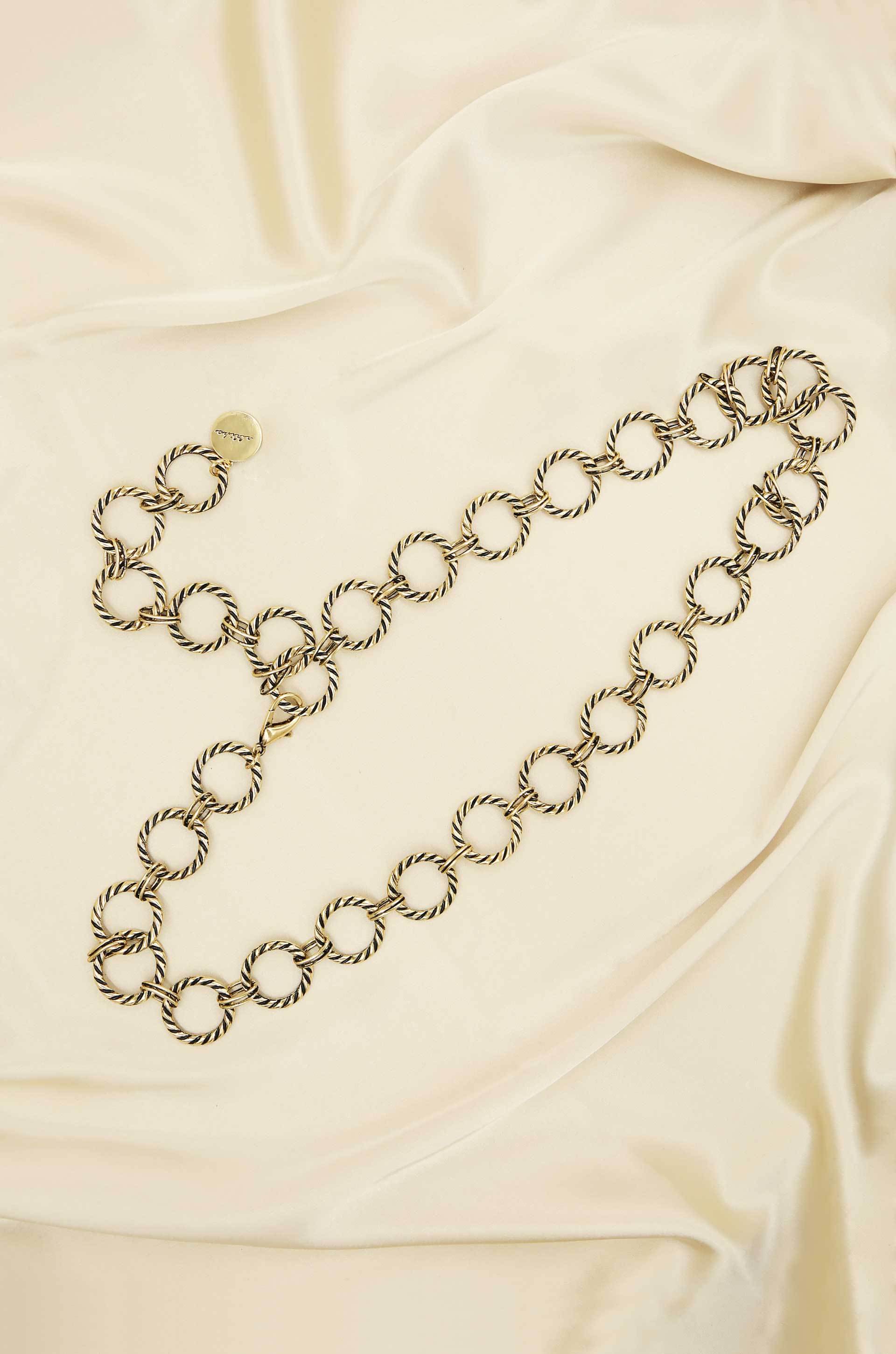 Loop It Through Belt in Antique Gold on slate background  