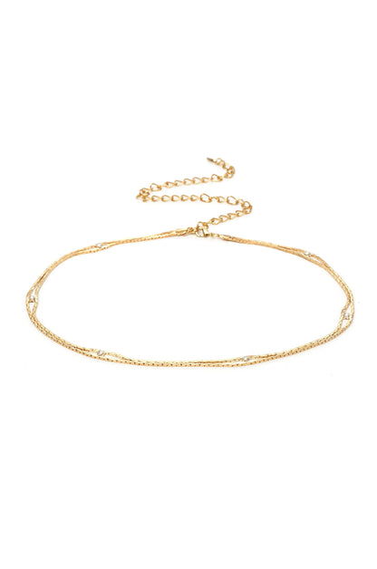 Always Relevant Gold Belt with Crystals on white background  