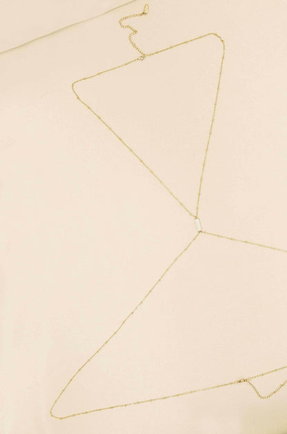 Sun Searcher Body Chain in Gold on slate background  
