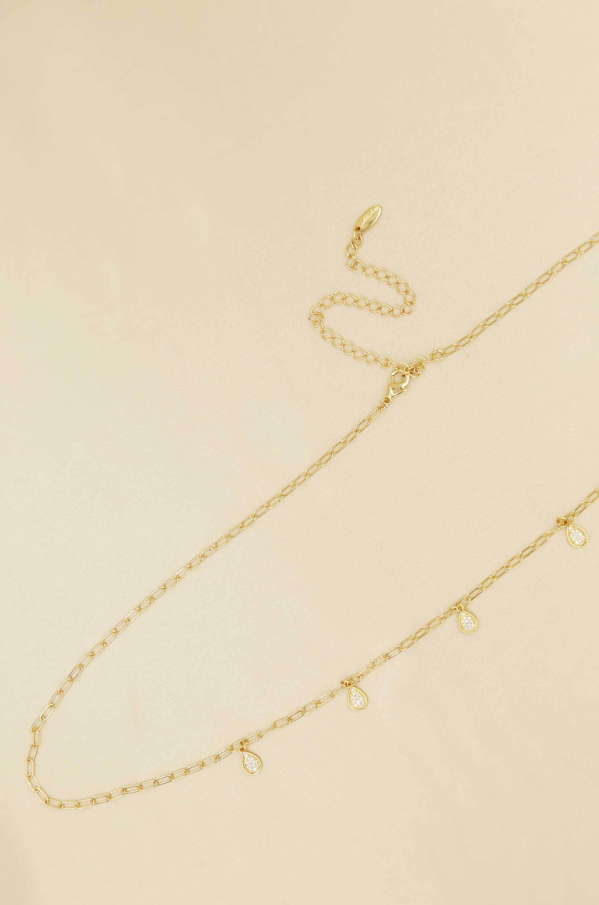 Delicate Crystal Droplet Gold Body Chain on slate background  