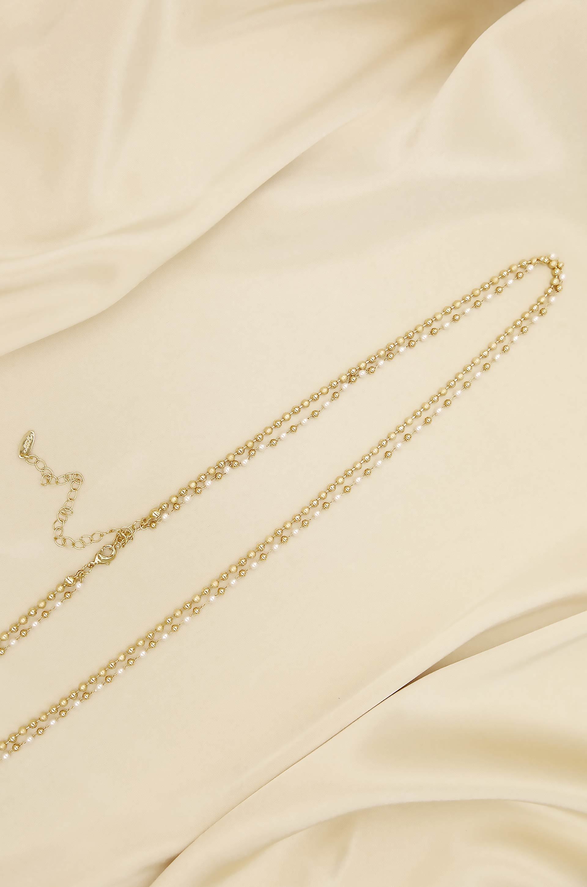 Pearl Strand Gold Body Chain on slate background  