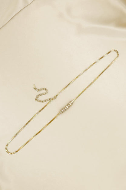 Single Strand Gold Plated Body Chain on slate background  