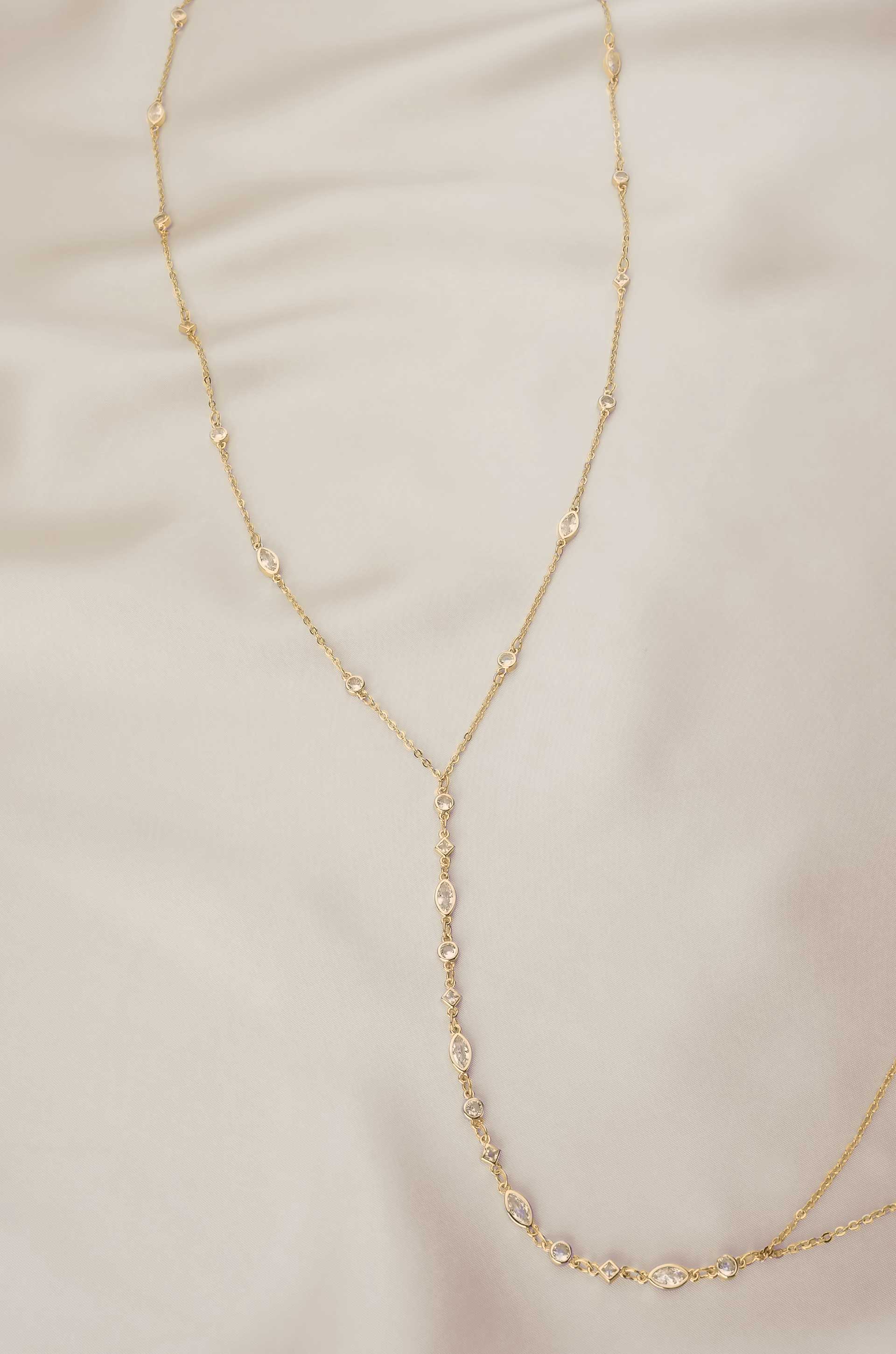 Blissful Crystal Body Chain in Gold on satin