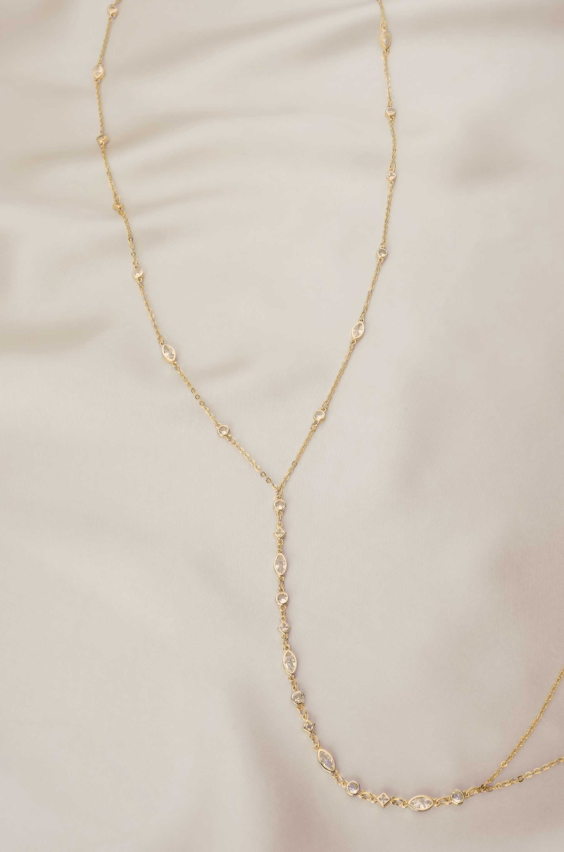 Blissful Crystal Body Chain in Gold on satin