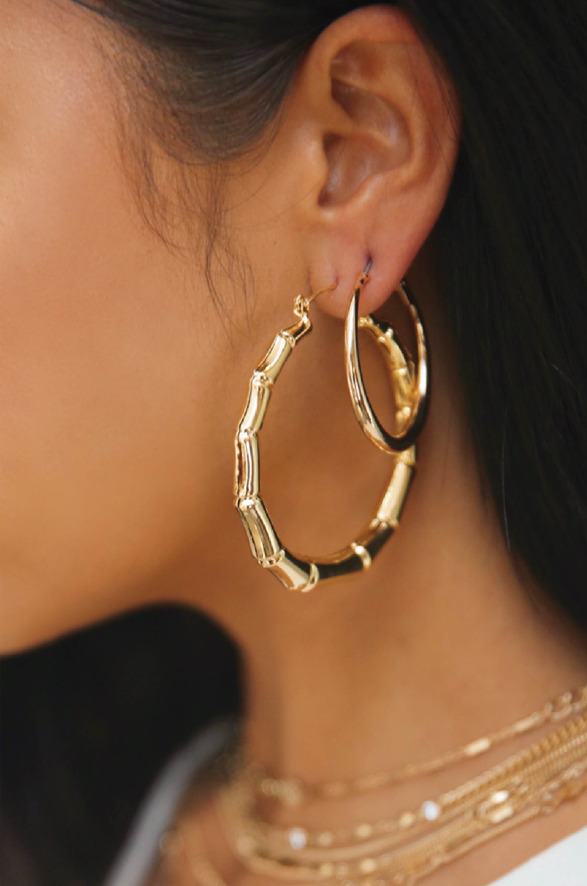 Bamboo 18kt Gold Plated Hoop Earrings shown on a model  