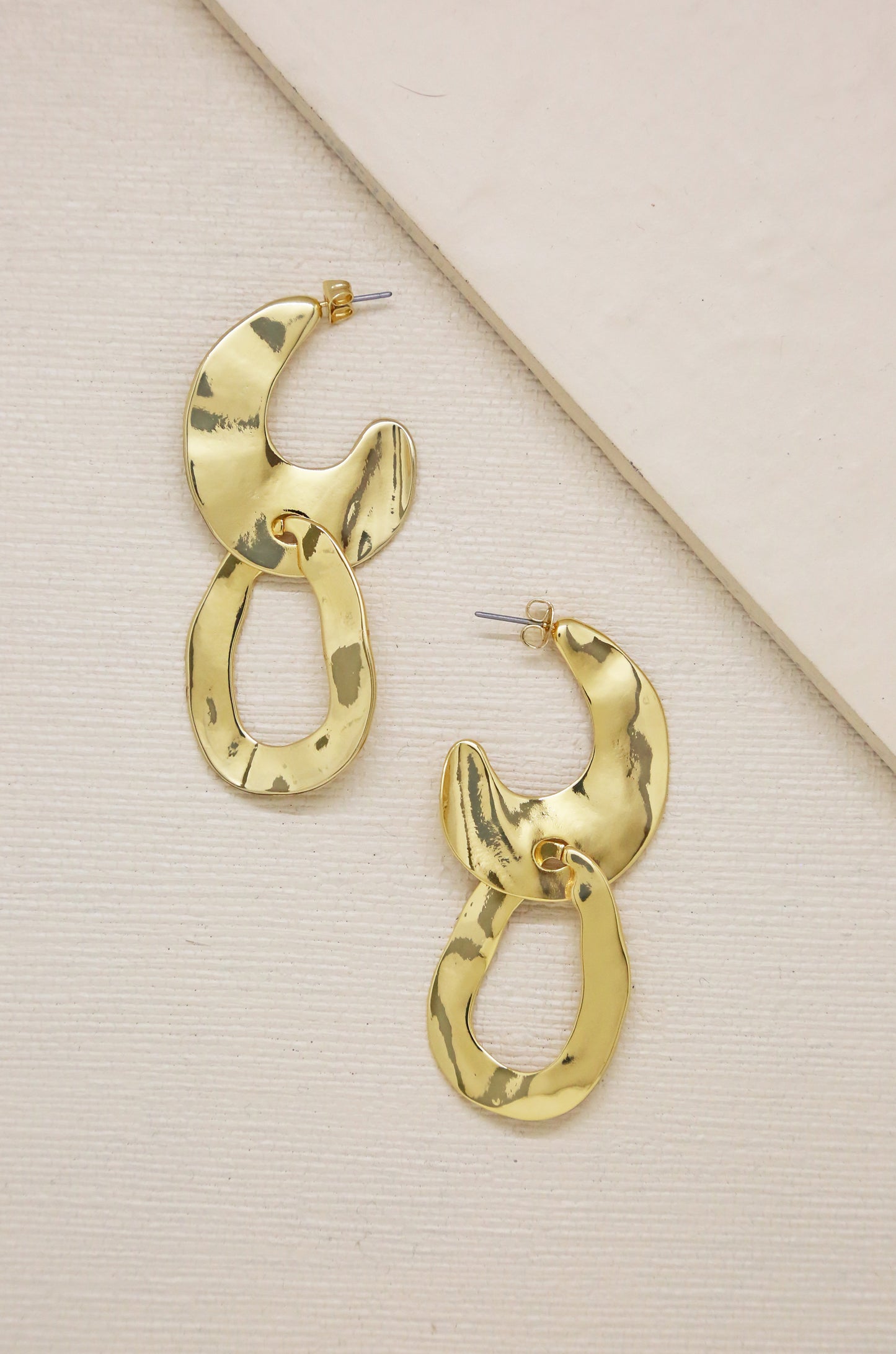Knock Knock Abstract Double Ring 18k Gold Plated Hoop Earrings on slate background  