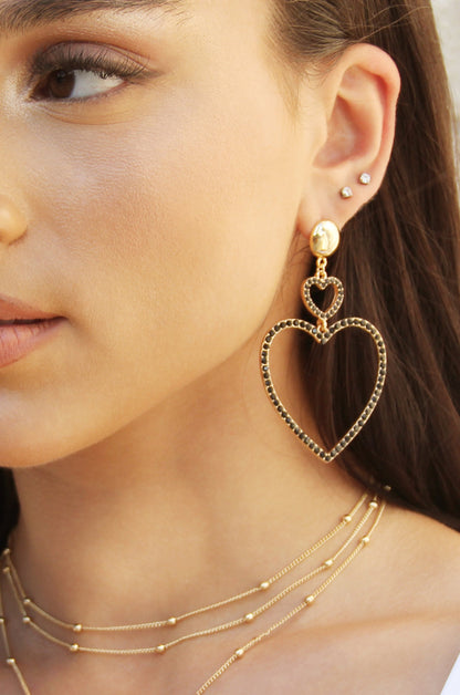 Double Heart Black Crystal Drop 18k Gold Plated Earrings on model 2