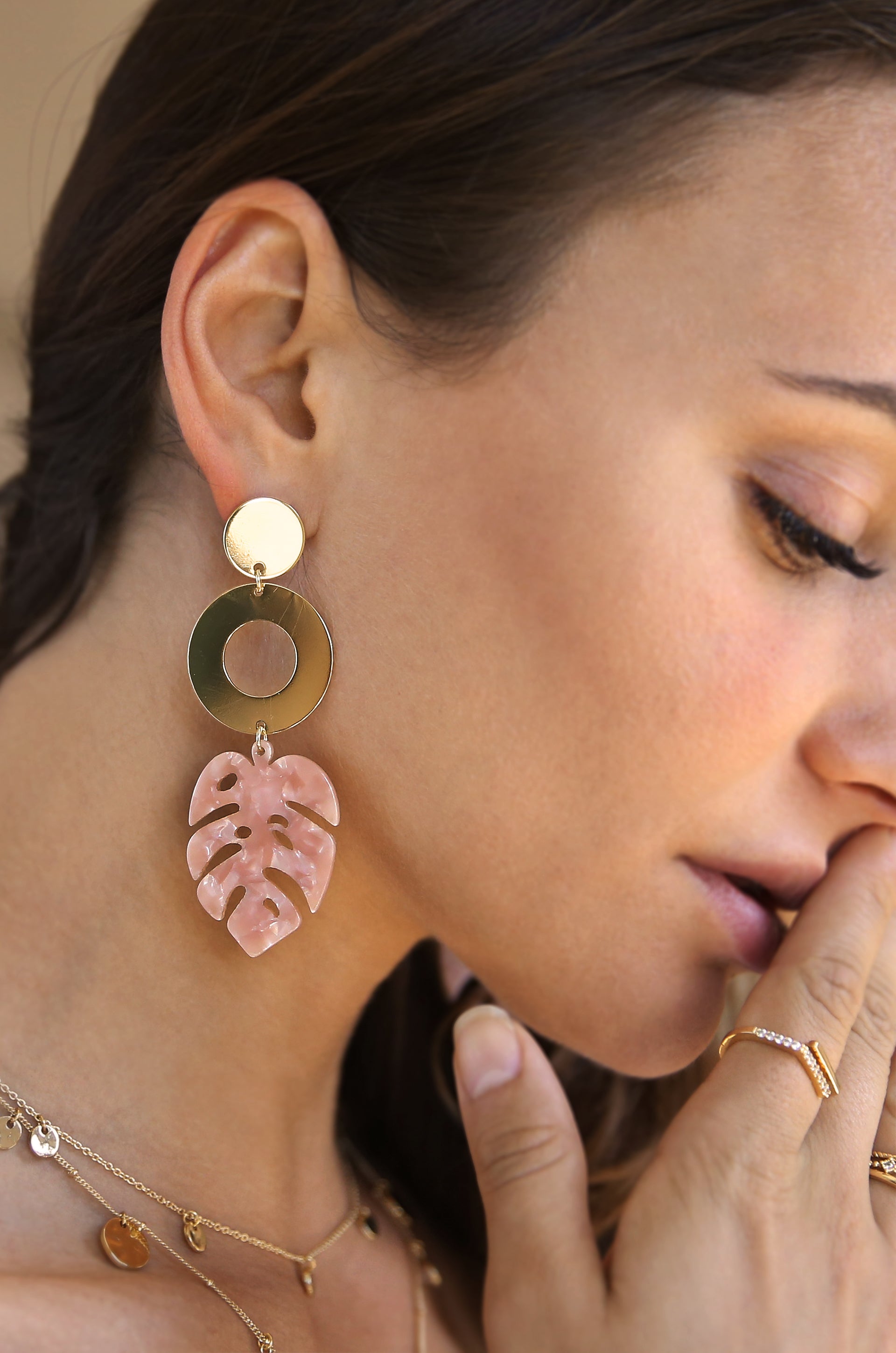 Tropics Blush Pink Resin Palm Leaf & 18k Gold Plated Earrings shown on a model  